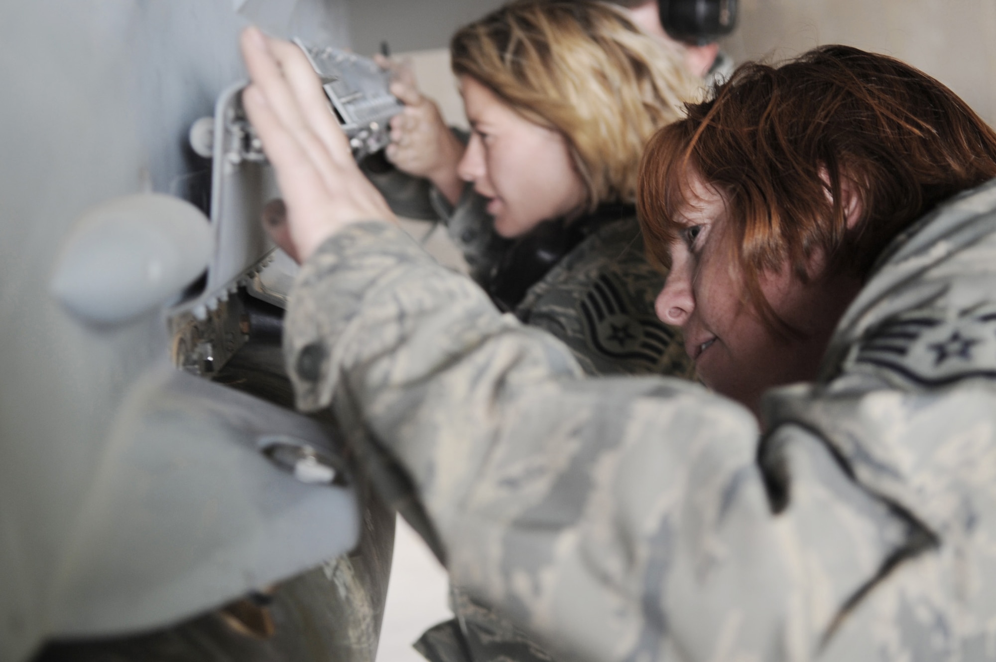 Staff Sgt. Carly Meckle (left) and Staff Sgt. Michelle Torrey check the connections after loading munitions onto an F-16 Fighting Falcon June 29 at Joint Base Balad, Iraq. Sergeants Meckle and Torrey are 332nd Expeditionary Aircraft Maintenance Squadron weapons loaders deployed from Buckley Air Force Base, Colo. Sergeant Meckle is a native of Lyons, Colo., and Sergeant Torrey is a native of Greeley, Colo. (U.S. Air Force photo/Senior Airman Elizabeth Rissmiller) 
