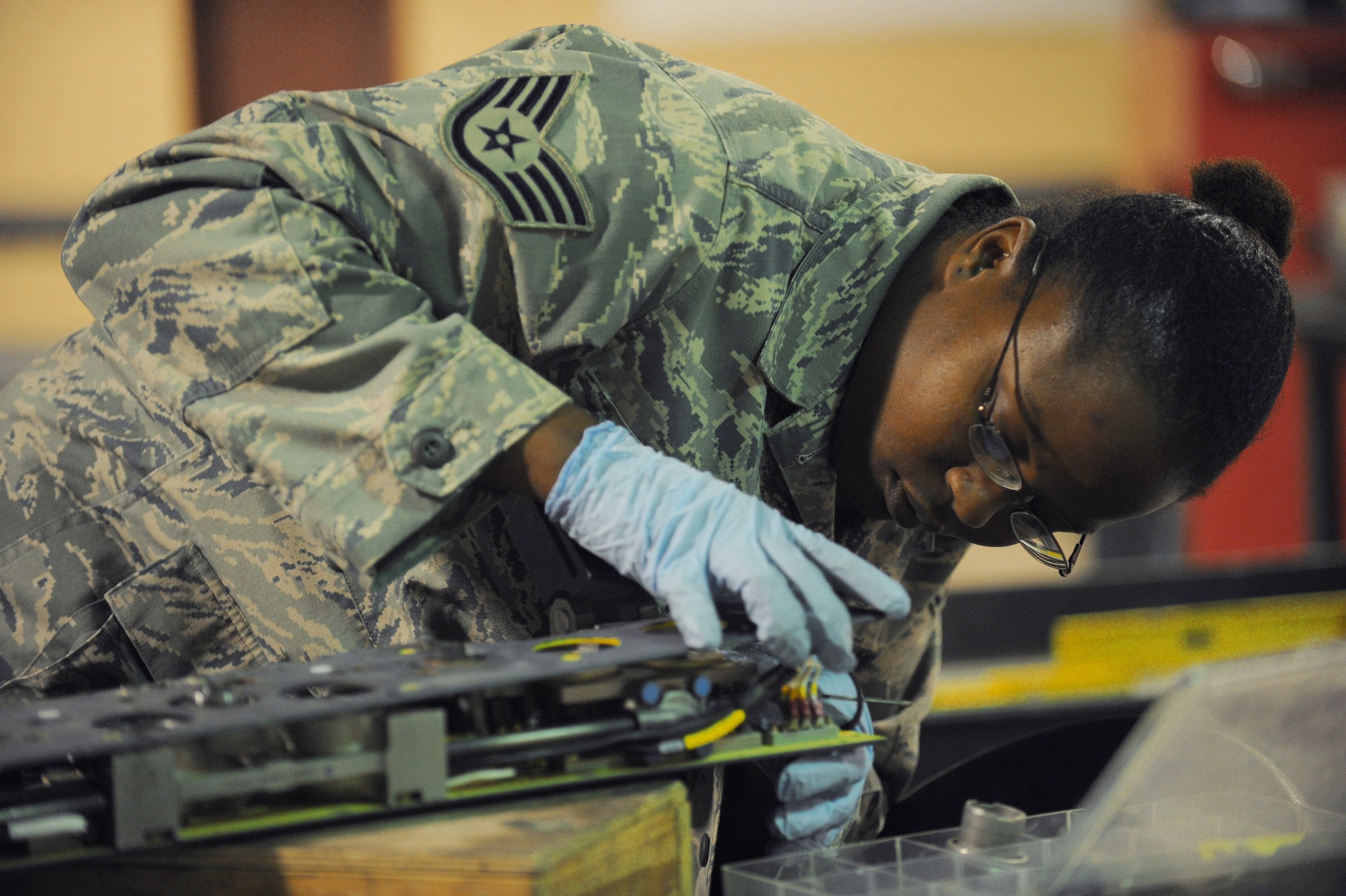Staff Sgt. Kusan Barter inspects a piece of weapons release equipment for an F-16 Fighting Falcon June 29 at Joint Base Balad, Iraq. Sergeant Barter is a 332nd Expeditionary Aircraft Maintenance Squadron armament-systems craftsman, deployed from Spangdahlem Air Base, Germany, and is a native of Pensacola, Fla. (U.S. Air Force photo/Senior Airman Elizabeth Rissmiller)