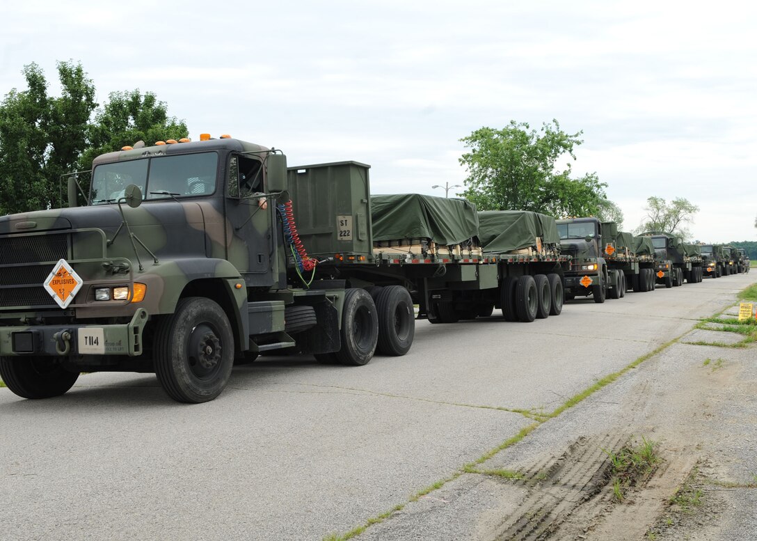 SCOTT AIR FORCE BASE, Ill. -- Trucks from the first of approximately 250 convoys out of Crane Army Ammunition Activity, Ind., wait in line at Scott for fuel before continuing on to their final destination at Fort Leonard Wood, Mo. as part of Operation Golden Cargo, July 14. (U.S. Air Force photo/ Airman 1st Class Wesley Farnsworth)