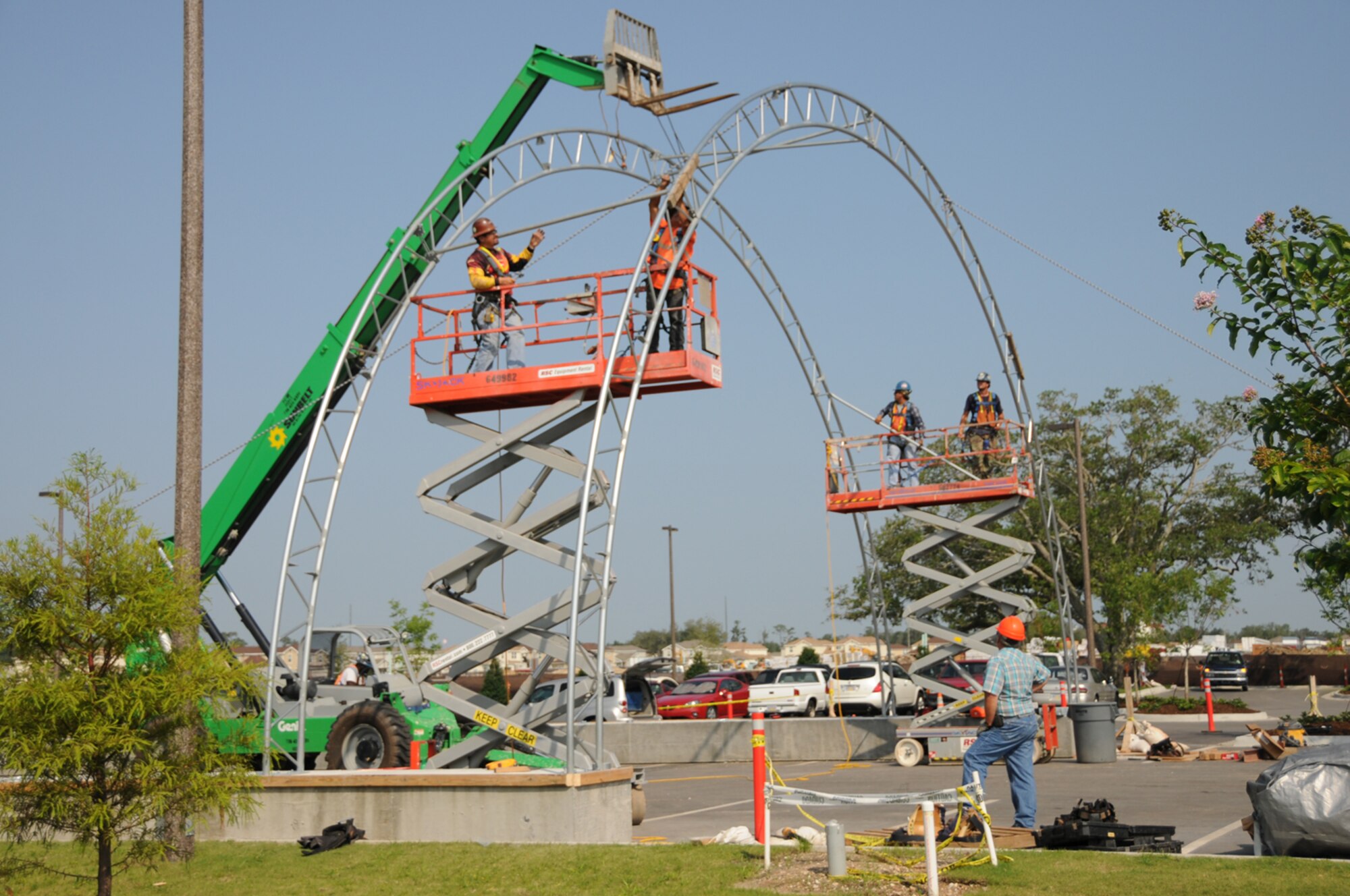 A temporary golf cart barn is going up so that the old structure can be torn down to continue construction of the new Bay Breeze Events Center.  (U.S. Air Force photo by Kemberly Groue)