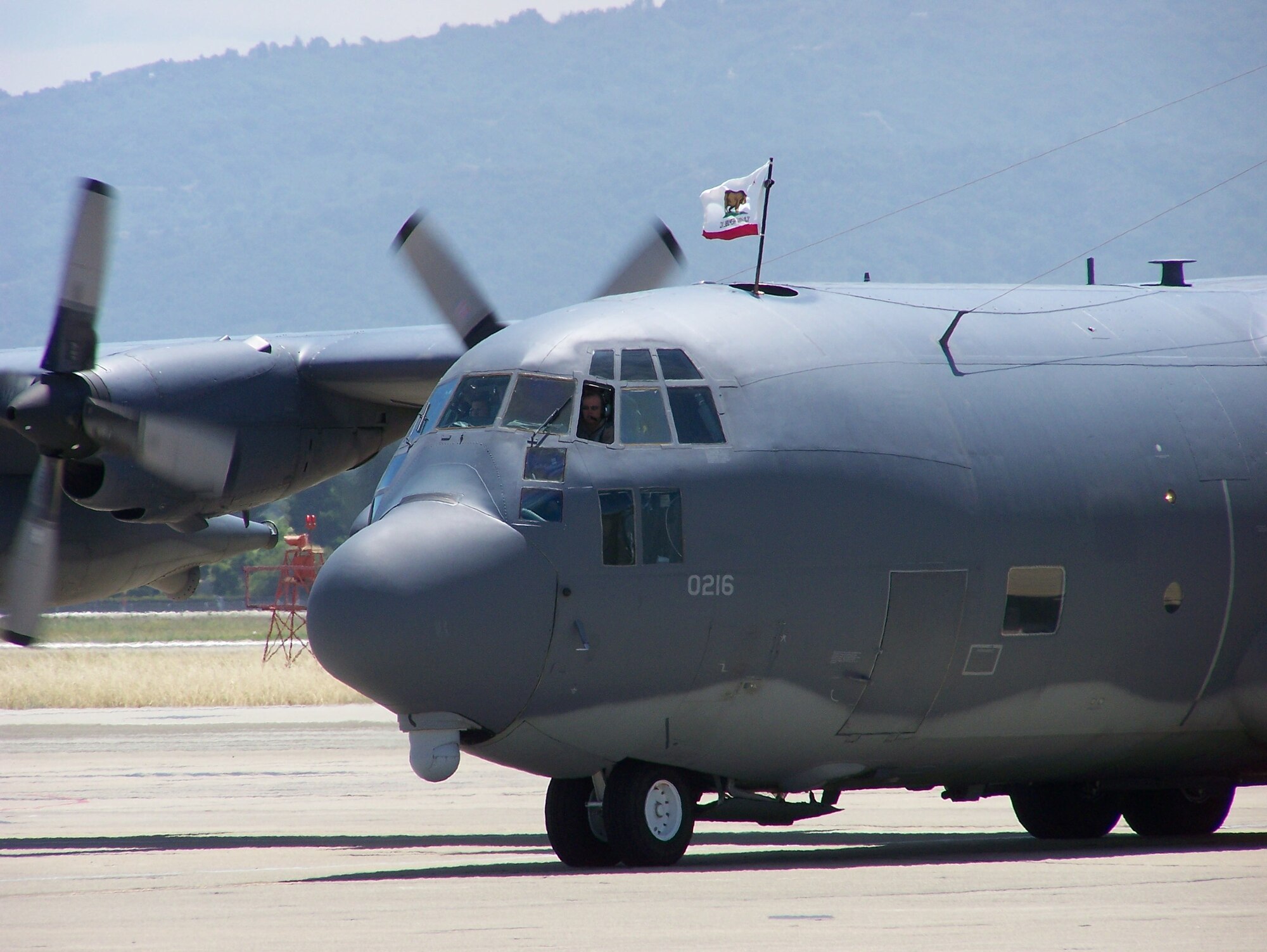 An aircrew taxis an MC-130P Combat Shadow at Moffett Federal Airfield, Calif., June 18. Fifty Airmen returned after a deployment to Djibouti where they provided combat search and rescue support for Combined Joint Task Force-Horn of Africa. (Air National Guard photy by Chief Master Sgt. Gary Ginestra)(RELEASED)