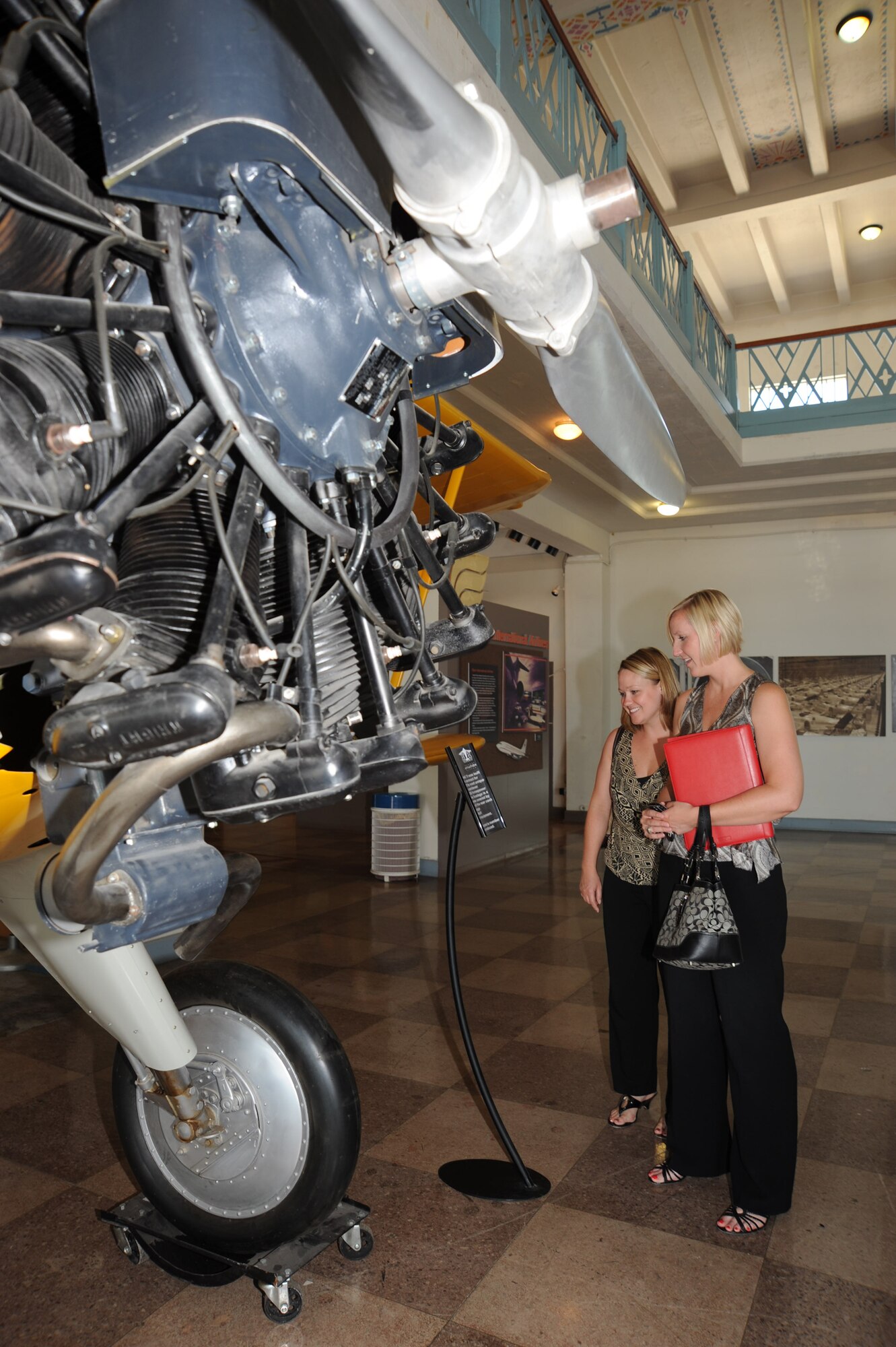 MCCONNELL AIR FORCE BASE, Kan. -- Amy Akers and Jennifer Everton, representatives for Wichita Young Men’s Christian Association, tour the Kansas Aviation Museum as part of the civic leader luncheon, July 14.  (Photo by Tech. Sgt. Chyrece Campbell)