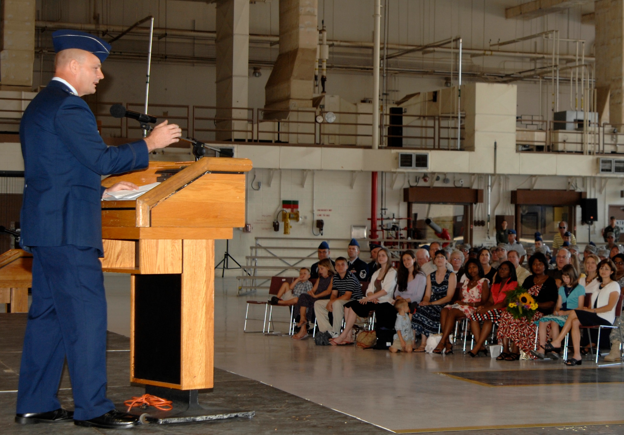 MCCONNELL AIR FORCE BASE, Kan. -- Col. Allan Day, 22nd Maintenance Group commander, addresses Team McConnell members during a change of command ceremony in hangar 1176, July 9. Colonel Day’s mission as the new commander is to direct Team McConnell members in maintaining KC-135 Stratotankers in refueling excellence and airlift commitments. (Photo by Senior Airman Laura Suttles)