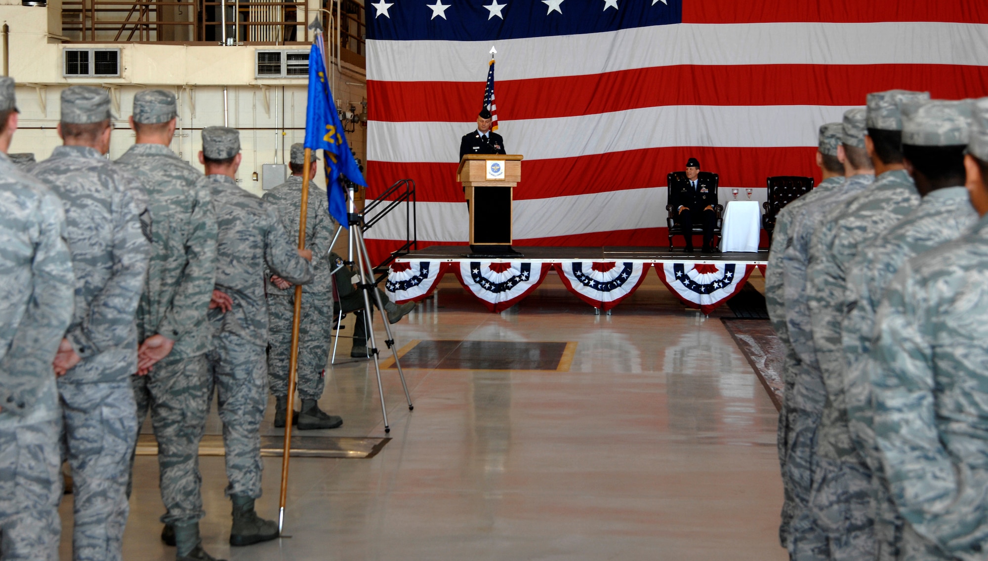 MCCONNELL AIR FORCE BASE, Kan. -- Col. Allan Day, 22nd Maintenance Group commander, speaks to Team McConnell members during a change of command ceremony in hangar 1176, July 9.The maintenance group is comprised of three squadrons: aircraft maintenance, maintenance, and maintenance operations. (Photo by Senior Airman Laura Suttles)