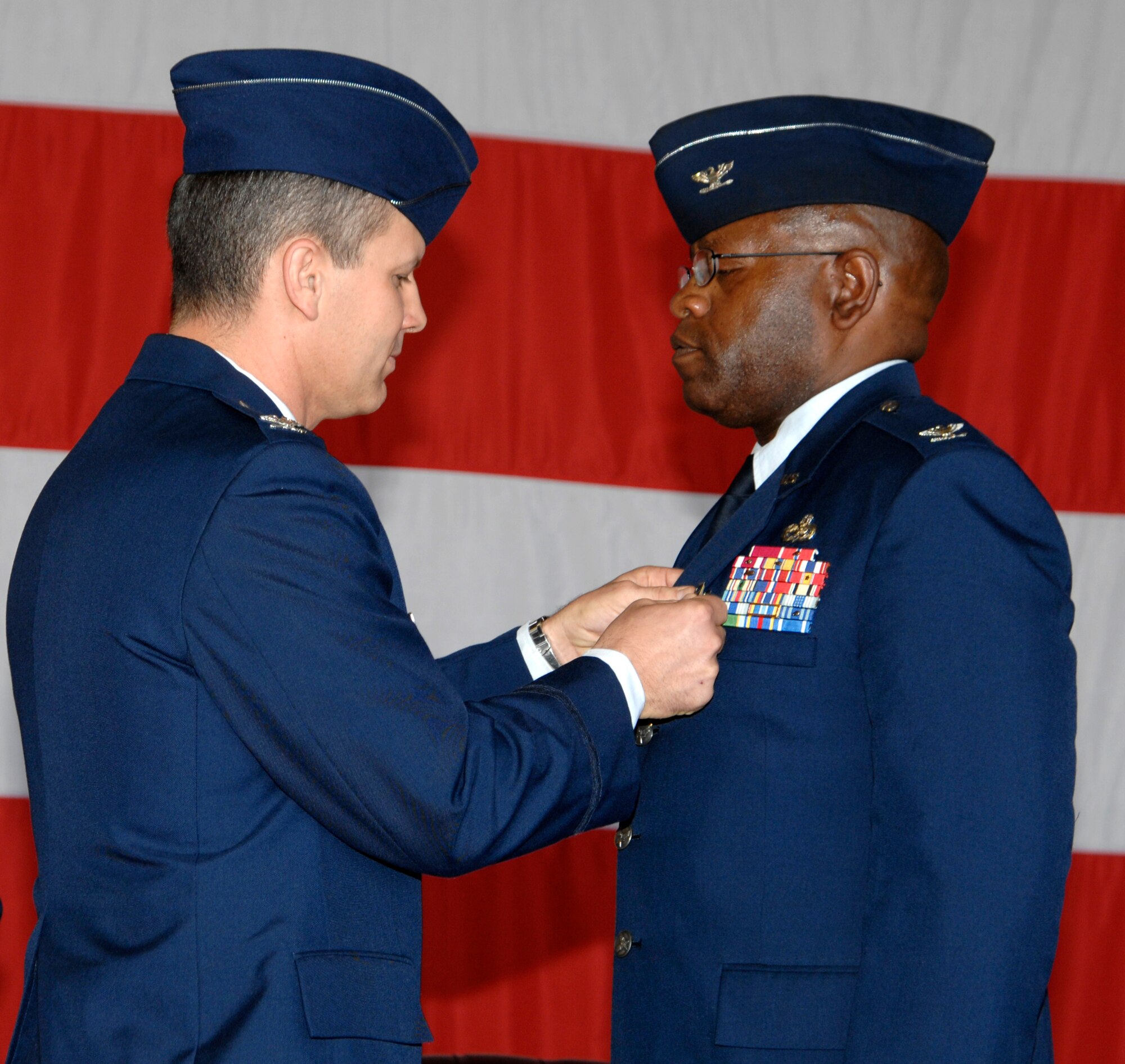 MCCONNELL AIR FORCE BASE, Kan. -- Col. Jamie W. Crowhurst presents Col. Michael Dillard, 22nd Maintenance Group former commander, with a Legion of Merit Medal during a change of command ceremony held in hangar 1176, July 9. The Legion of Merit Medal is only one of six U.S. awards which is to be displayed around the neck as opposed the chest as most decorations are worn. (Photo by Senior Airman Laura Suttles)