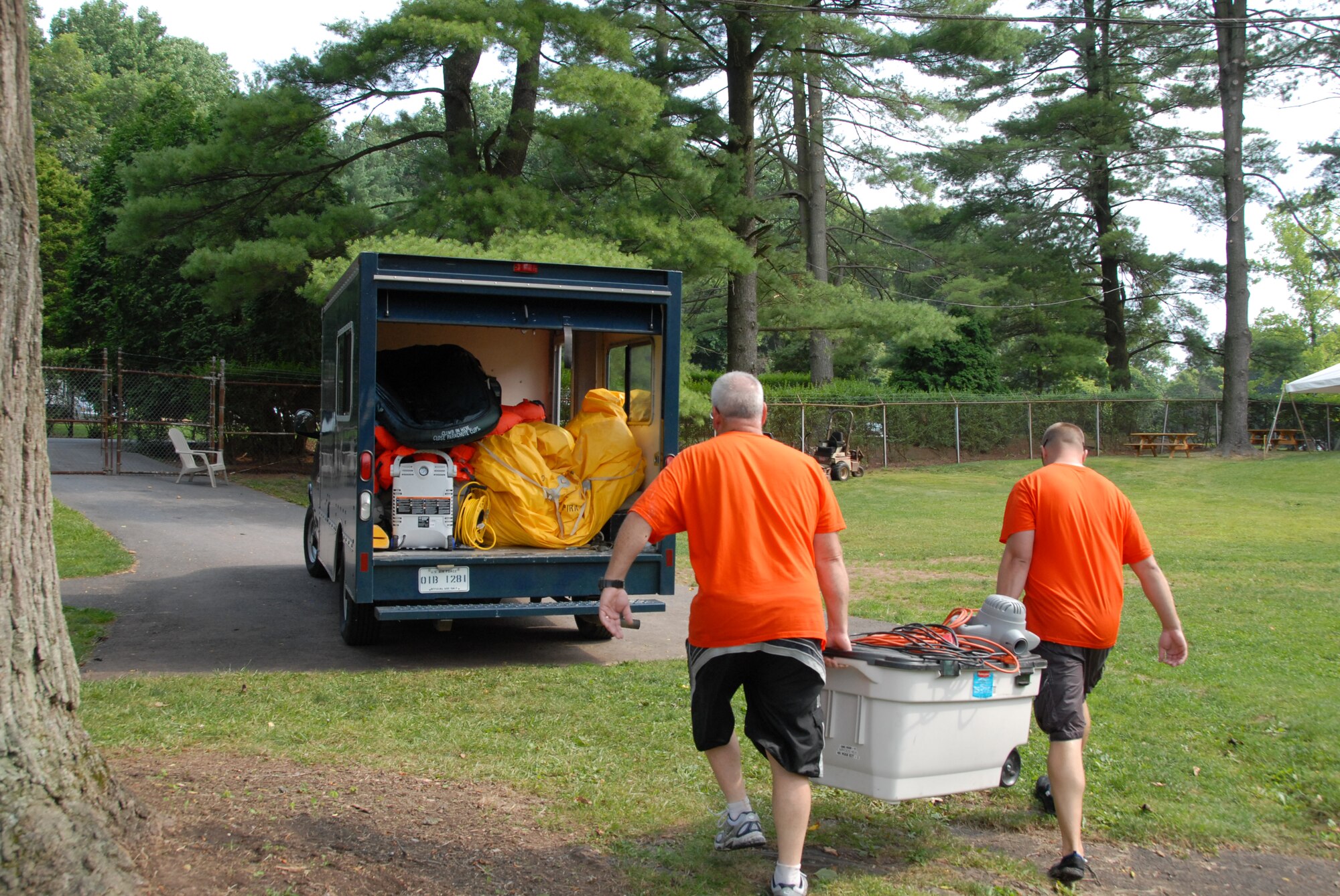 Master Sgt. Steven Mannino and Master Sgt. Kevin Rhyder, aircrew flight equipment technicians at the 193rd Special Operations Wing located in Middletown, Pa., clean up after conducting water survival training. Water survival training was held at Mount Gretna Lake, Pa., for 193rd SOW flight crew members on July 11, 2009.