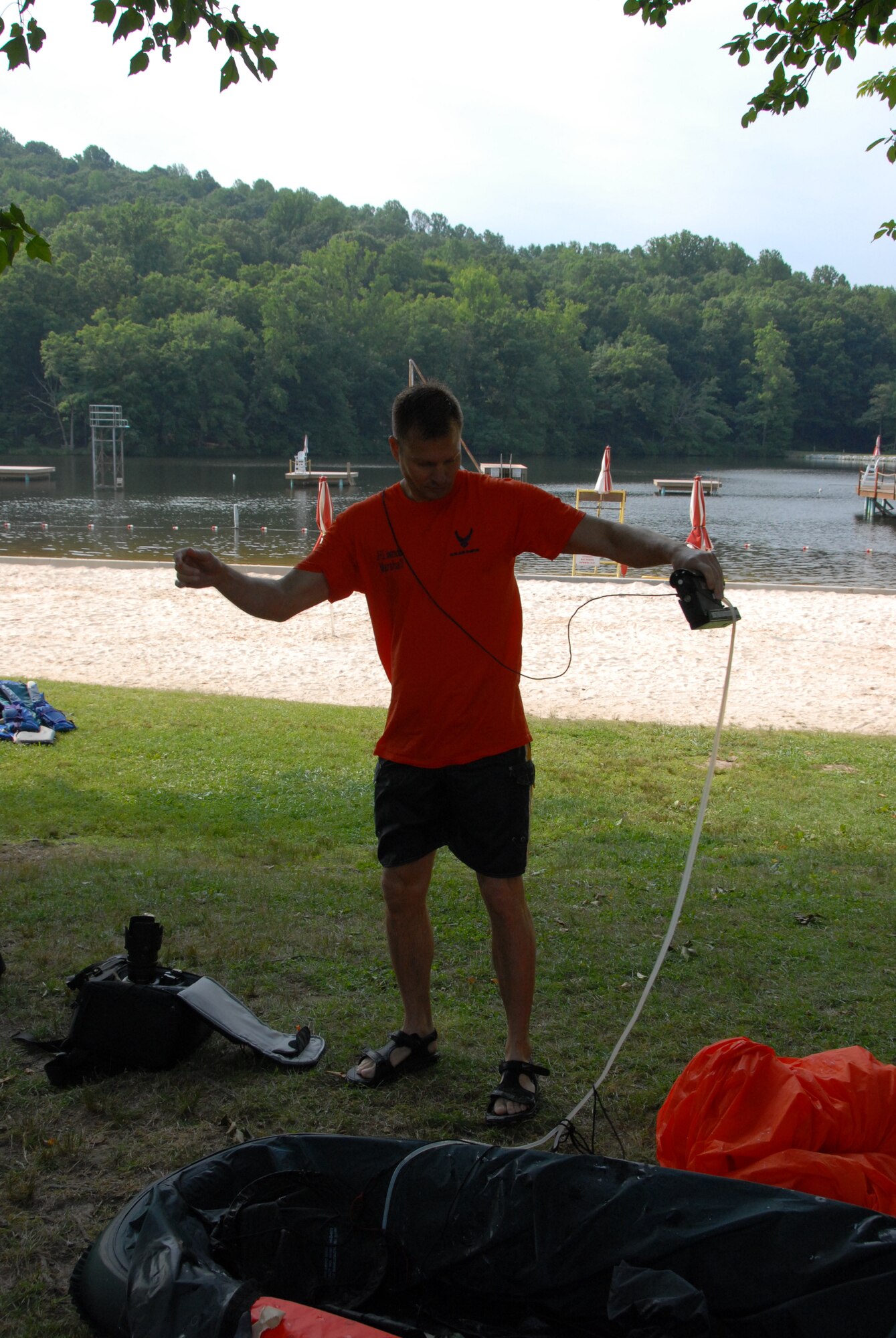 Senior Master Sgt. Matt Marshall, the aircrew flight equipment superintendent at the 193rd Special Operations Wing located in Middletown, Pa., cleans up after conducting water survival training. Water survival training was held at Mount Gretna Lake, Pa., for 193rd SOW flight crew members on July 11, 2009.