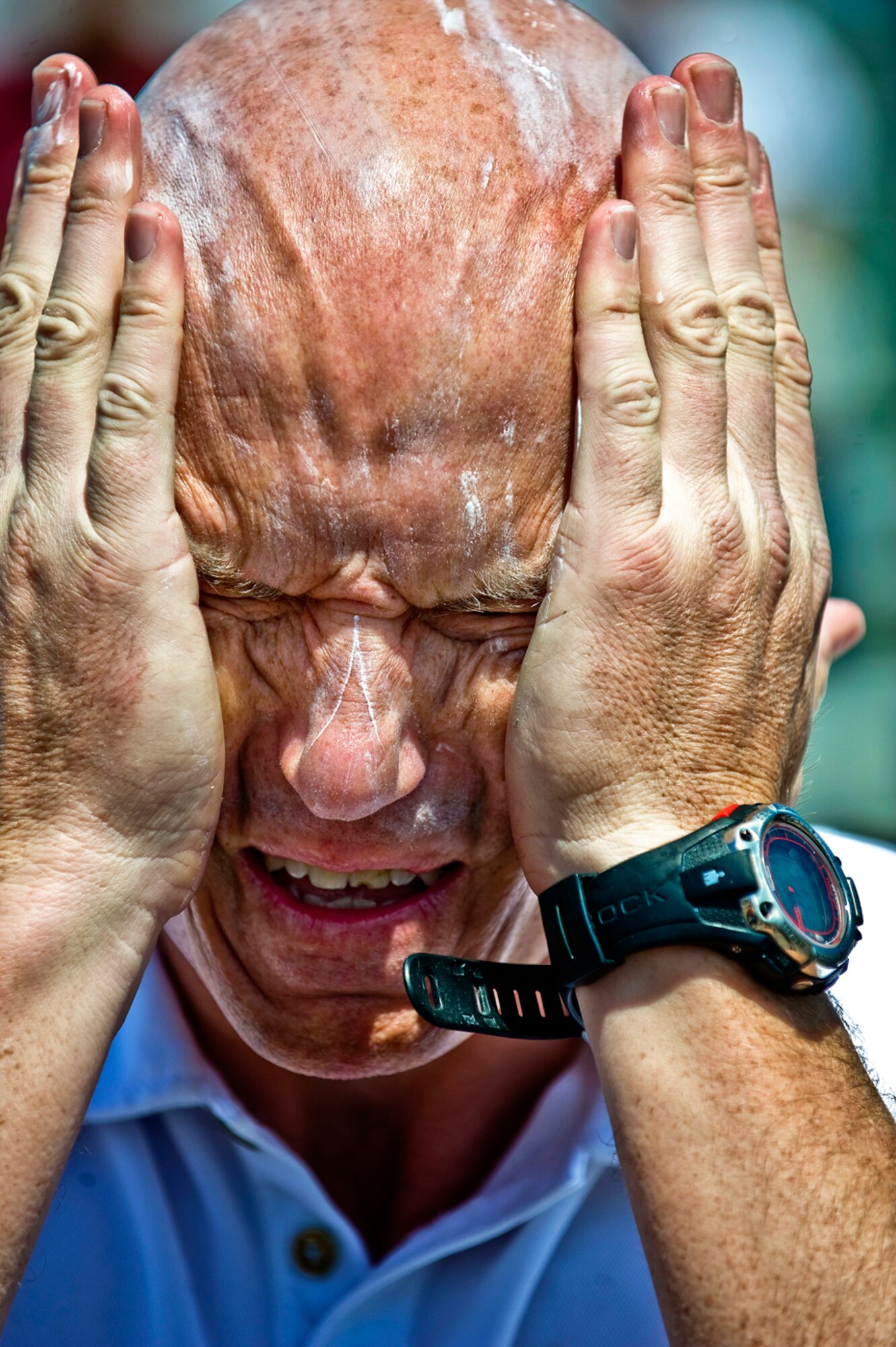 True Grit - Putting on a healthy layer of sunscreen was essential for Turnipseed and other racers as they spent more than four hours in the relentless sun. (photo by Tech. Sgt. Matthew Hannen)