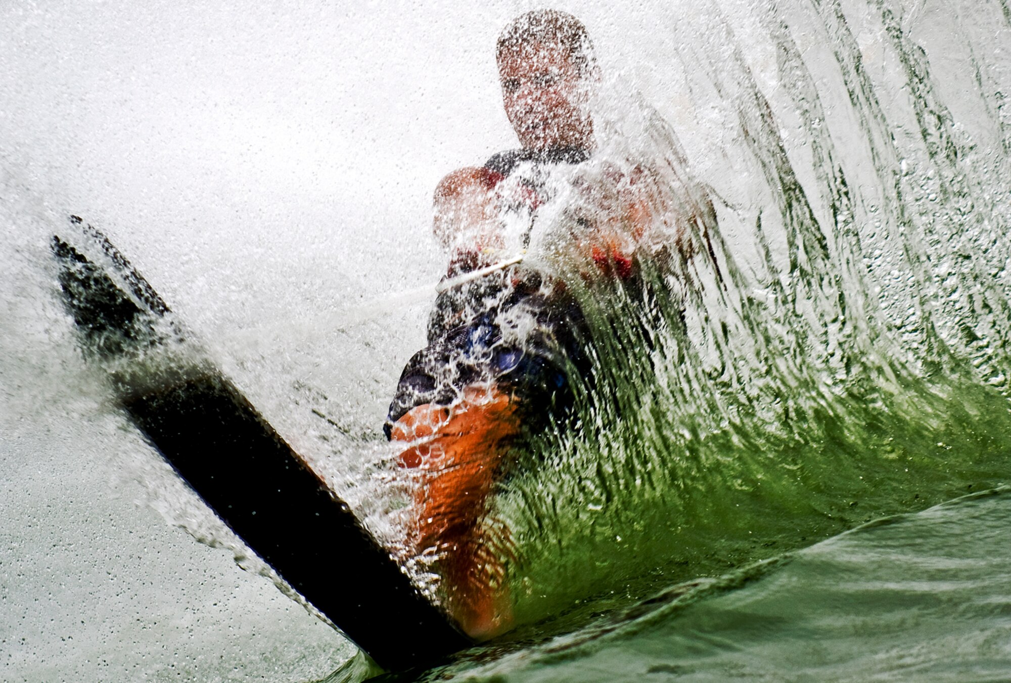 JOE vs. H2O - Chris Goelz, a staff sergeant with the Air Force Reserve, is engulfed by a wall of water he created while taking advantage of the water skiing opportunities at the Fort Sam Houston military marina at Canyon Lake, Texas, June 30, 2008. With boating deaths on the rise nationwide this past year, military members can take free safe boating classes through their base outdoor recreation program. (photo by Tech. Sgt. Matthew Hannen)