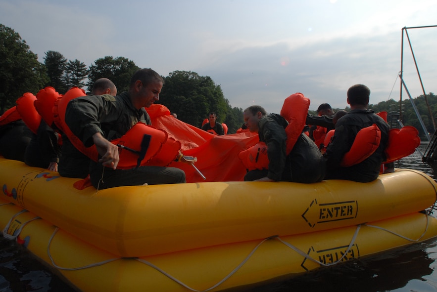 Flight crew members from the 193rd Special Operations Wing, located in Middletown, Pa., experience what it is like on a 46-man raft during water survival training. This training was held at a lake in Mount Gretna, Pa., on Saturday July 11, 2009.