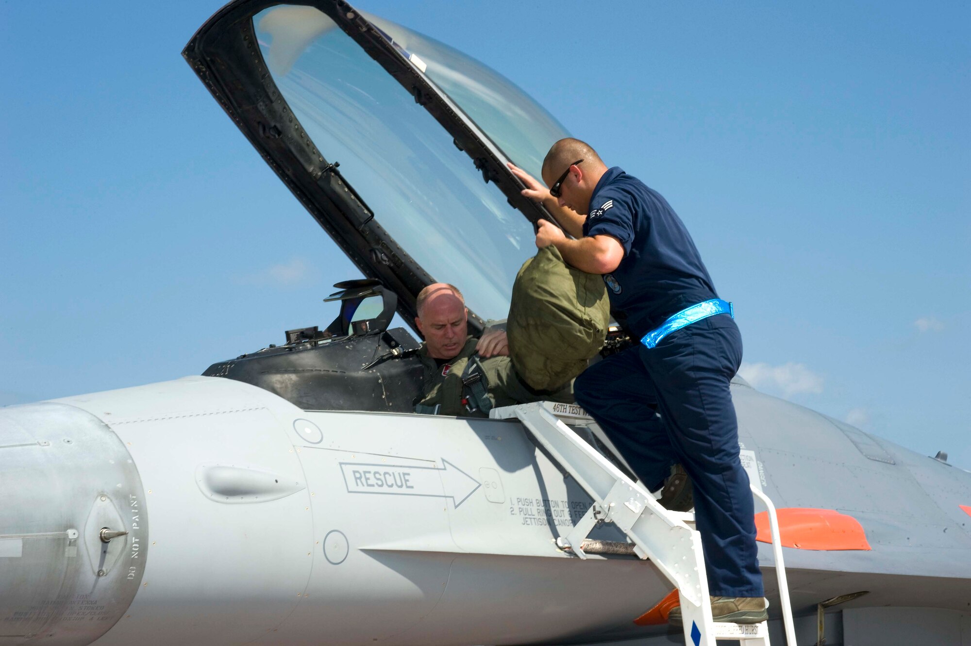 Col. Gary Plumb, 46th Test Wing commander, prepares for his final flight in an F-16.  He took his "fini" flight July 14 since he is scheduled to retire July 20 after serving more than 27 years in the Air Force.  Colonel Plumb has commanded the 46th TW for more than two years. (U.S. Air Force Photo/Bruce Hoffman)