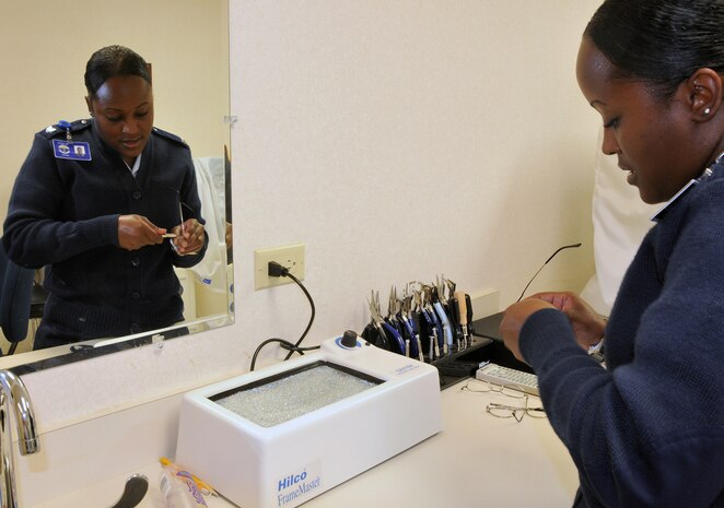 Staff Sgt. Alexis Alexander repairs a pair of glasses at the base optometry office here July 13. The optometry office receives 10 to 15 pairs of glasses a week for repairs ranging from missing screws and nose pads, to bent frames. Sergeant Alexander is the NCO in charge of the base optometry office. (U.S. Air Force photo/Staff Sgt. Daniel Bowles)
