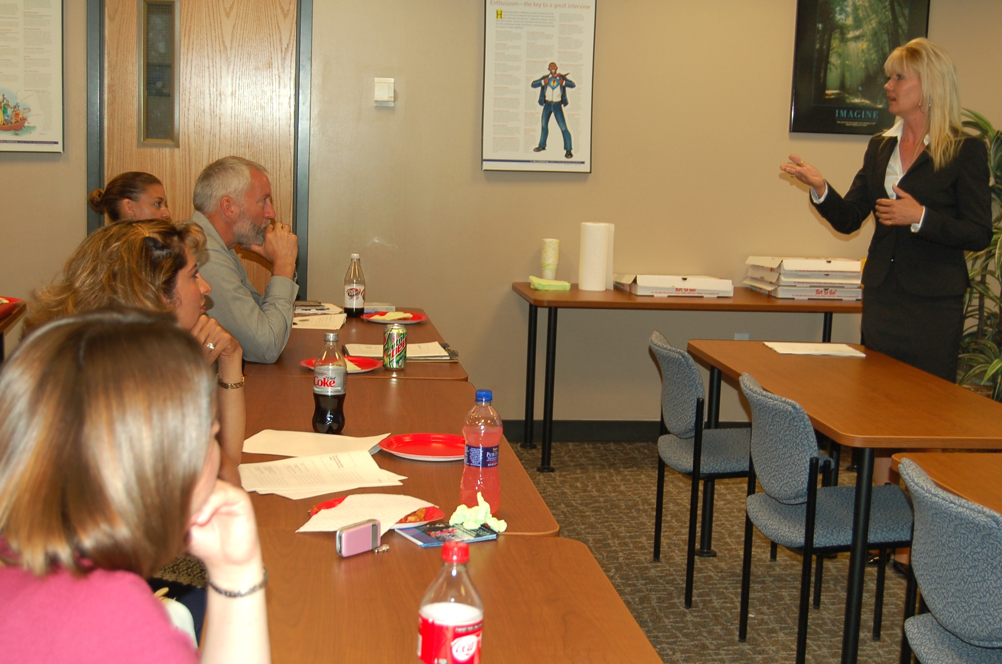 Jan Kienast, 21st Force Support Squadron, Airman and Family Readiness Flight community readiness specialist, speaks with participants during the new communication class at Peterson Air Force Base Airman and Family Readiness Center June 23. The flight works in a team environment, where extending gratitude to team members is crucial to the communication process. (U.S. Air Force photo by Thea Skinner)