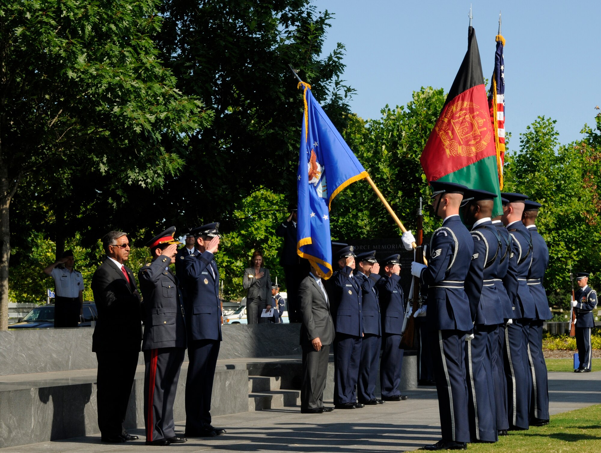 Gen. Norton Schwartz, Air Force chief of staff, and Maj. Gen. Mohammad Dawran, commander Afghan National Army Air Corps, salute during the playing of the United States and Afghanistan national anthems played by the United States Air Force Band during an arrival ceremony held in General Dawrans honor July 14 at the Air Force Memorial in Arlington, Va. The arrival ceremony welcomed General Dawran to the United States and started his nationwide tour of Air Force installations. (U.S. Air Force photo by Staff Sgt. Dan DeCook)