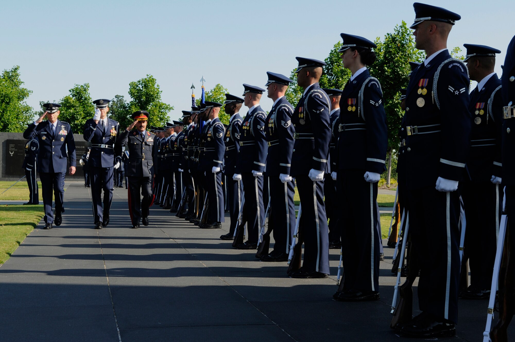 Gen. Norton Schwartz, Air Force chief of staff, and Maj. Gen. Mohammad Dawran, commander Afghan National Army Air Corps, are led by 1st Lt. Chad Frey, United States Air Force Honor Guard, during an inspection of the troops as part of an arrival ceremony held in General Dawrans honor July 14 at the Air Force Memorial in Arlington, Va. The arrival ceremony welcomed General Dawran to the United States and started his nationwide tour of Air Force installations. (U.S. Air Force photo by Staff Sgt. Dan DeCook)