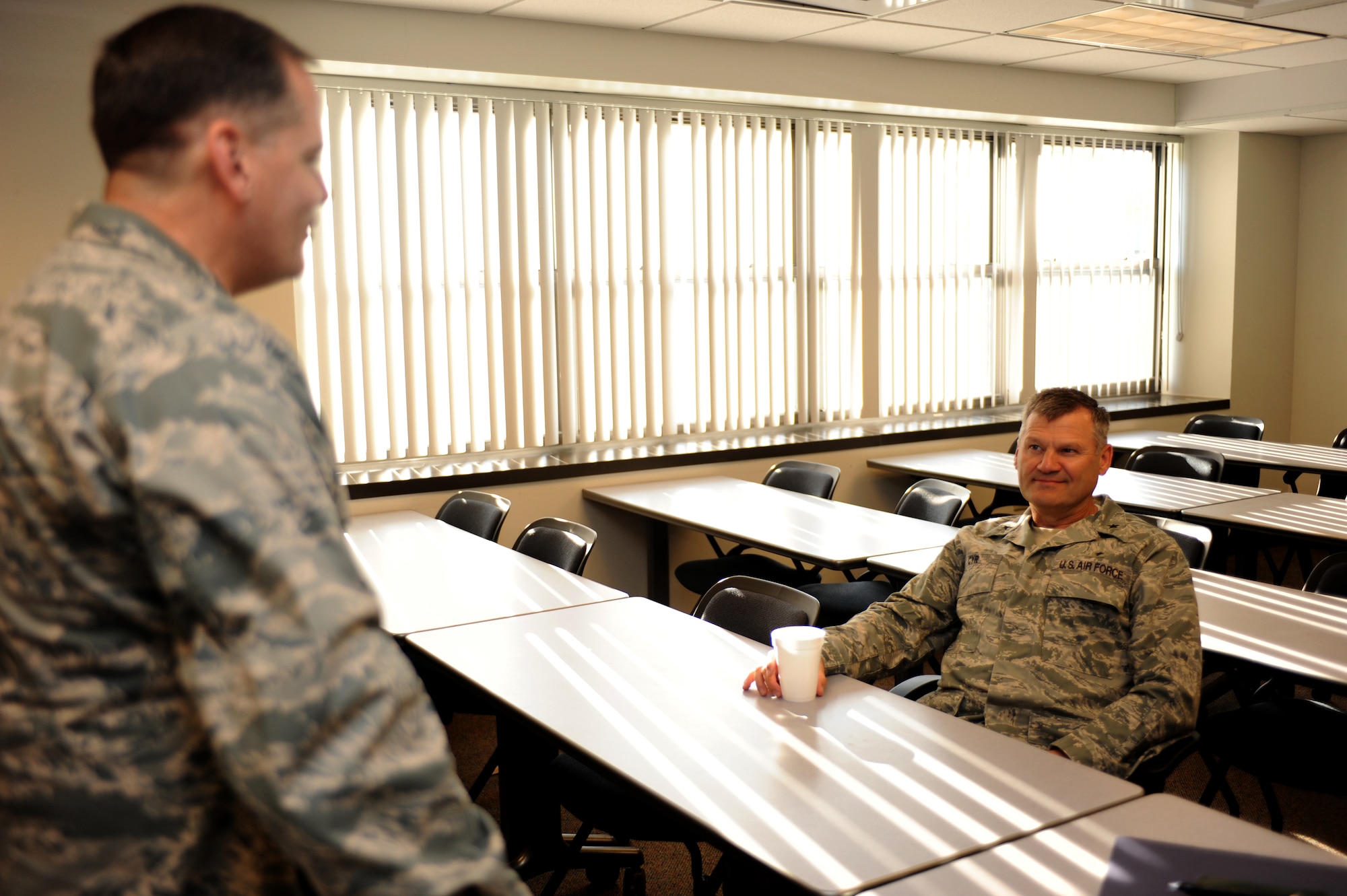 Chaplain (Brig. Gen.) David Cyr, Air Force Deputy Chief of Chaplains, speaks with Chaplain (Maj.) Thomas Porter, U.S. Air Force Expeditionary Center chaplain, during chaplain and chaplain assistant functional training July 9 at the Expeditionary Center on Joint Base McGuire-Dix-Lakehurst, N.J.  Chaplain Cyr visited the installation to receive first hand experience the type of training provided by the center.  (U.S. Air Force Photo/Staff Sgt. Nathan G. Bevier) 