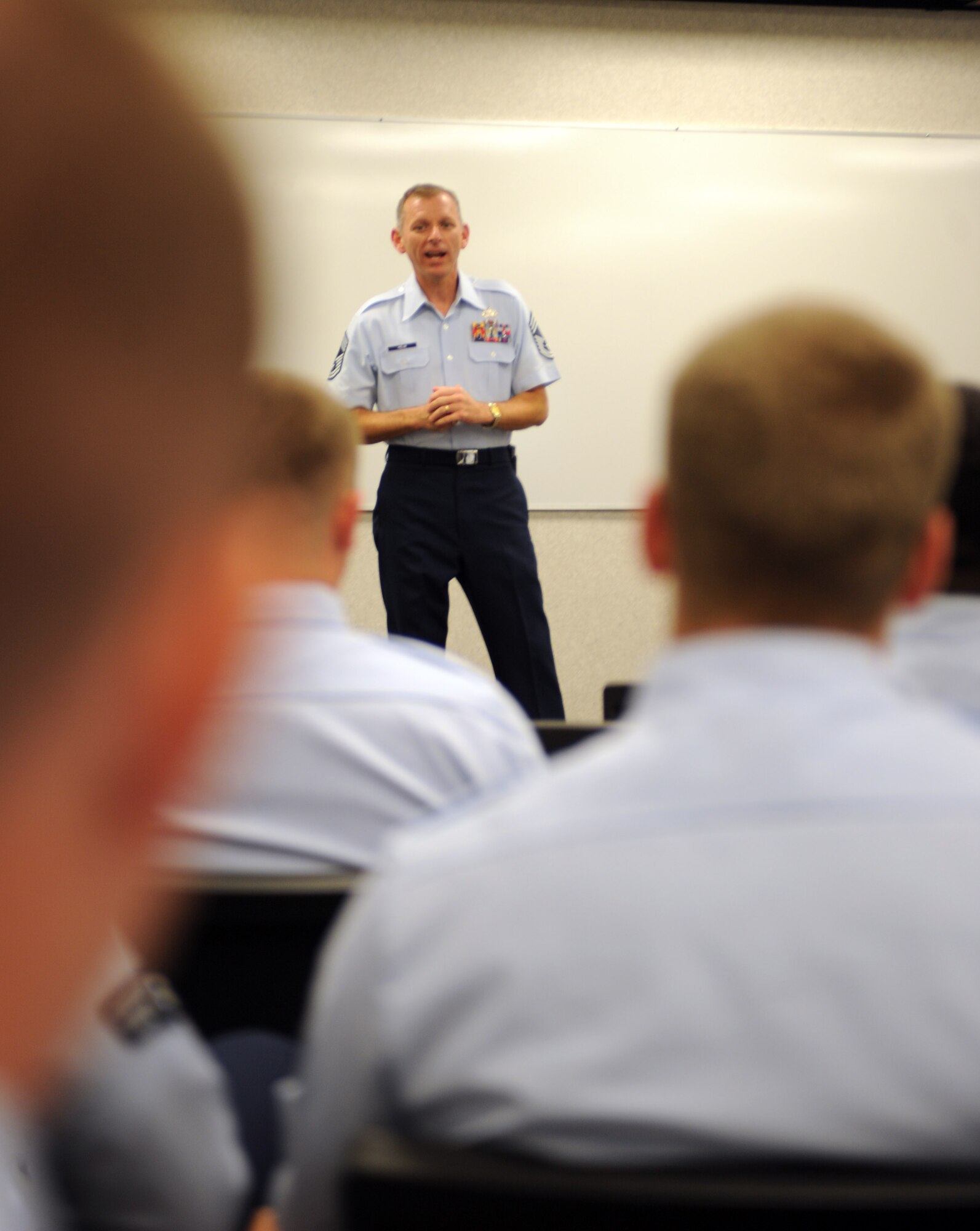Chief Master Sgt. Jeffry Helm, senior enlisted leader to the Commanding General, Army and Air Force Exchange Service, visits with Airmen attending Airman Leadership School here, July 13. Chief Helm travels to Army and Air Force installations worldwide to present updates on AAFES activities and to provide the AAFES commander with feedback on issues affecting AAFES' customers. (U.S. Air Force photo/Airman 1st Class Adam Grant)