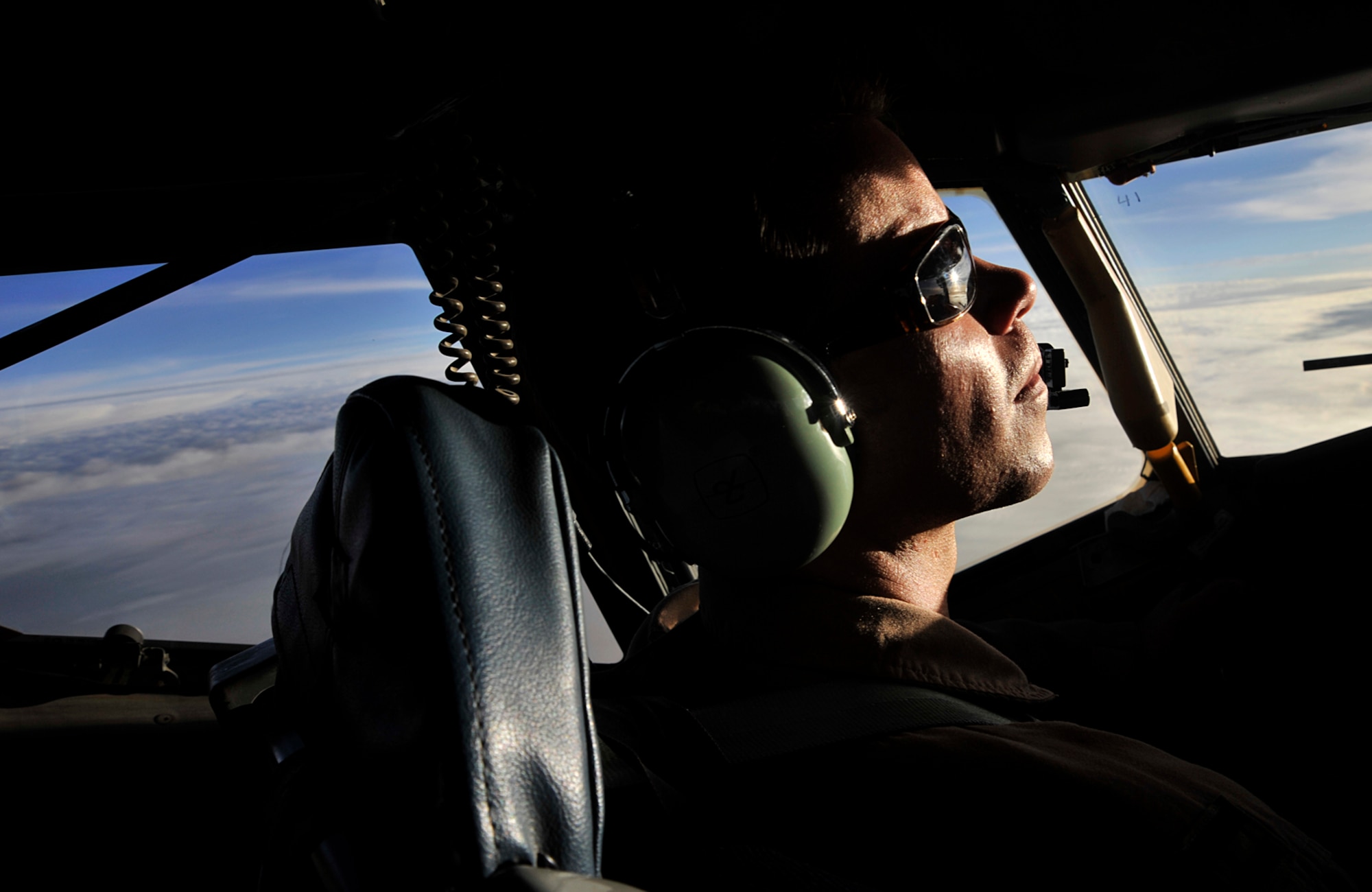 Capt. Christopher Dickens, 340th Expeditionary Air Refueling Squdaron, monitors KC-135 Stratotanker flight systems, July 11, during a refueling mission over Afghanistan. The KC-135 Stratotanker provides the core aerial refueling capability for the Air Force and also supports Navy, Marine Corps and allied nation aircraft. Captain Dickens hails from Laurinburg, N.C., and is deployed from MacDill Air Force Base, Fla., in support of Operations Iraqi and Enduring Freedom. (U.S. Air Force photo by Staff Sgt. Shawn Weismiller). 