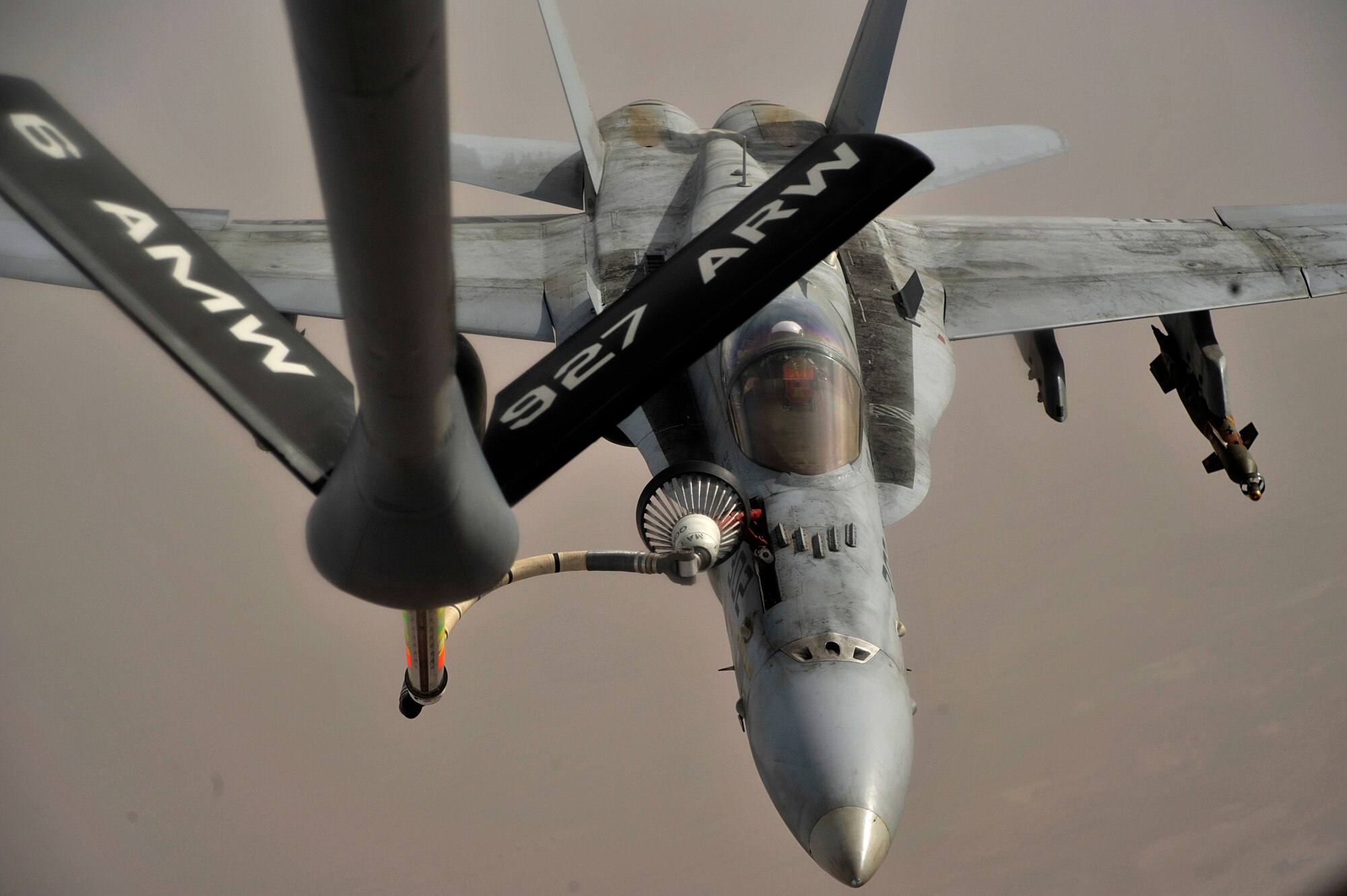 A U.S. Navy F-18C Hornet aircraft receives fuel July 11, from a KC-135 Stratotanker during a mission over Afghanistan during Operation Enduring Freedom. The KC-135 is assigned to the 340th Expeditionary Air Refueling Squadron in Southwest Asia. (U.S. Air Force photo /Staff Sgt. Shawn Weismiller)
