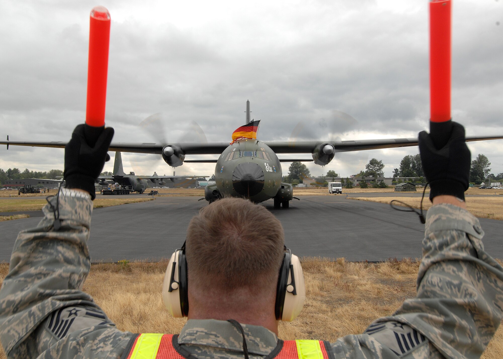 Master Sgt. Jeff Barsaloux, 446th Aircraft Maintenance Squadron, marshals in a German C-160 Transall at McChord as international competitors arrive for Air Mobility Command's Rodeo 2009. (U.S. Air Force photo/Staff Sgt. Stephen Schester)