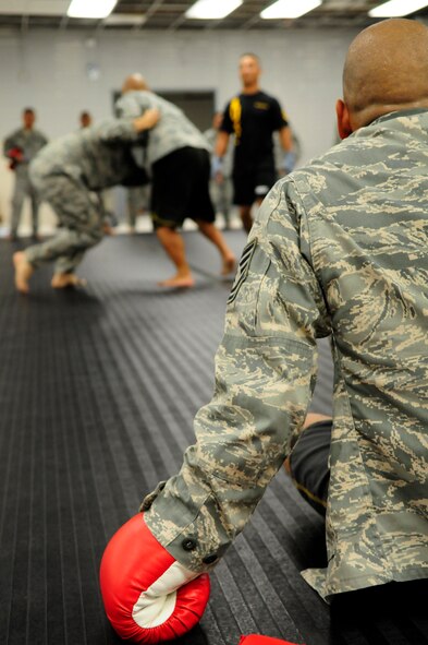 ANDERSEN AIR FORCE BASE, Guam - Tech. Sgt. Gerson Hoebing, 254th Guam Air National Guard recruiter, relaxes after a match during a Modern Army Combative Training session here July 9. The program is designed to teach Soldiers and Airmen how to fight hand-to-hand when weapons use is not practical in a combat situation. (U.S. Air Force photo by Airman 1st Class Courtney Witt)