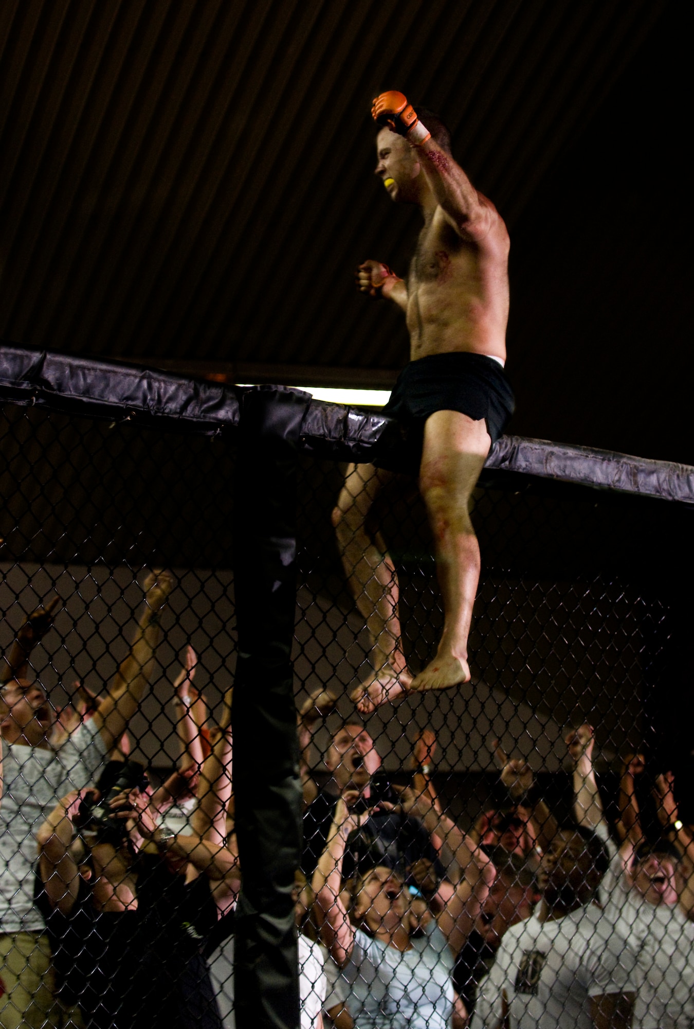 Bryan Onderdonk of Team Catacomb celebrates his win against Igor Montes of Germany, during his professional debut in mixed martial arts, July 11, 2009, Baumholder, Germany. Onderdonk is a staff sergeant with the 786th Security Forces Squadron at Sembach Annex, Germany. (U.S. Air Force photo by Senior Airman Nathan Lipscomb)