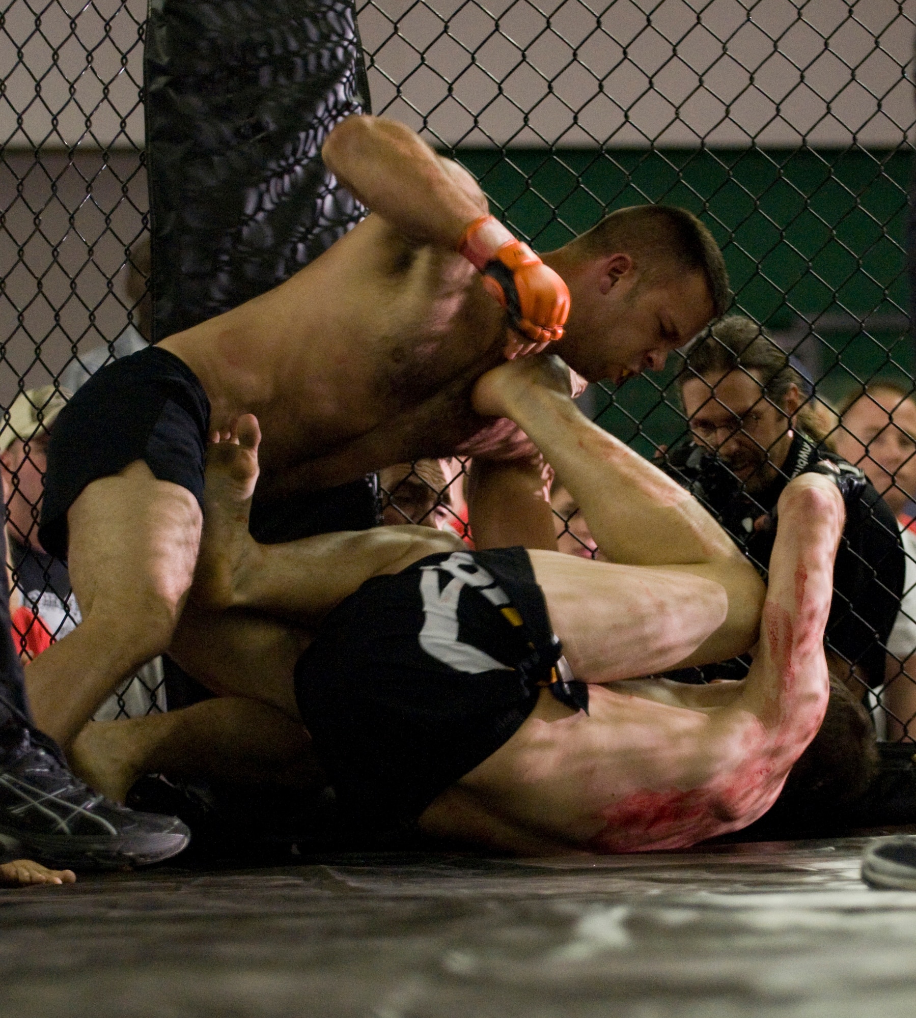 Bryan Onderdonk of Team Catacomb takes down Igor Montes of Germany, winning his professional debut in mixed martial arts, July 11, 2009, Baumholder, Germany. Onderdonk is a staff sergeant with the 786th Security Forces Squadron at Sembach Annex, Germany. (U.S. Air Force photo by Senior Airman Nathan Lipscomb)