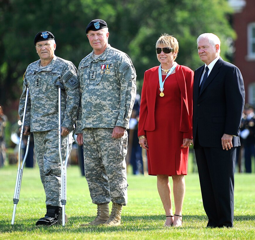 Gen. George W. Casey, Army Chief of Staff, left, Army Gen. David D. McKiernan and wife Carmen and Defense Secretary Robert M. Gates pause during McKiernan's full honors retirement ceremony on Fort Myer, Va., July 15, 2009.