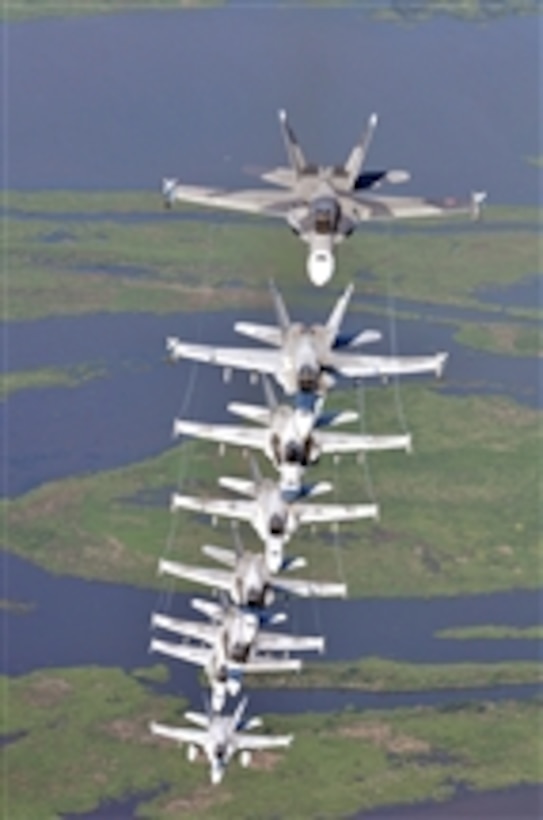 U.S. Navy F/A-18 Hornet aircraft assigned to Strike Fighter Squadron 204 fly in a column formation during a photo exercise in Louisiana on July 11, 2009.  Strike Fighter Squadron 204 is stationed on Naval Air Station Joint Reserve Base New Orleans.  