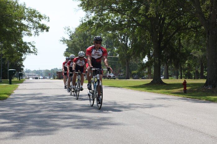 Marines with the Wounded Warrior Battalion – East and Brian Renier, cycling project manager, ride around Marine Corps Base Camp Lejeune during one of their cycling sessions. Cycling is currently being used as a form of rehabilitation with the Warrior Athlete Rehabilitation program with the battalion.  It is designed to help with the recovery process and overcome the Marines’ injuries while getting back into physical shape and building their morale.  Aside from increasing muscle strength, endurance and balance, it also manages weight, improves memory and help controls behavior.