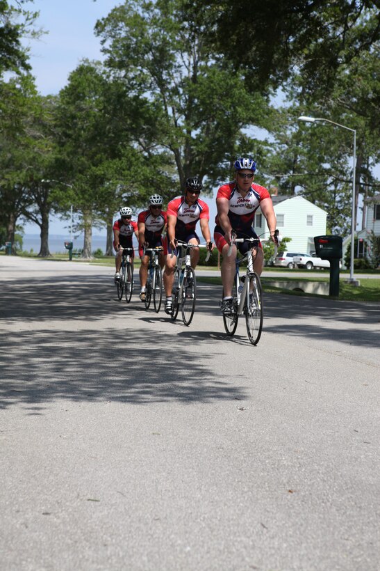 Marines with the Wounded Warrior Battalion – East and Brian Renier, cycling project manager, ride around Marine Corps Base Camp Lejeune during one of their cycling sessions. Cycling is currently being used as a form of rehabilitation with the Warrior Athlete Rehabilitation program with the battalion.  It is designed to help with the recovery process and overcome the Marines’ injuries while getting back into physical shape and building their morale.  Aside from increasing muscle strength, endurance and balance, it also manages weight, improves memory and help controls behavior.