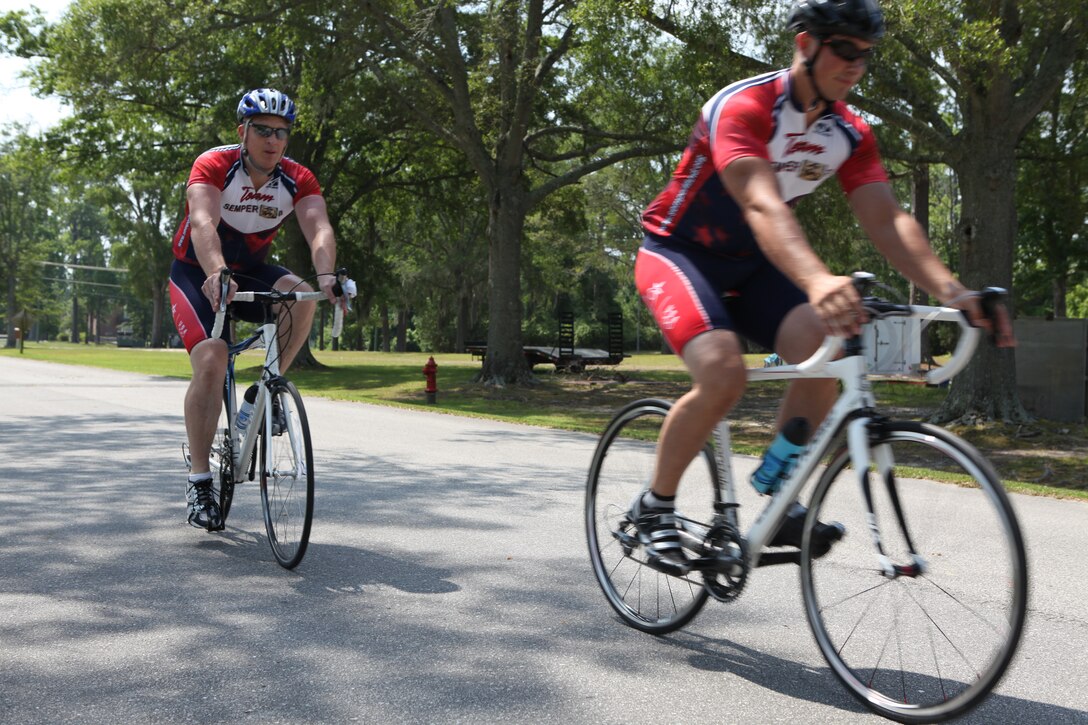 Marines with the Wounded Warrior Battalion – East and Brian Renier, cycling project manager, ride around Marine Corps Base Camp Lejeune during one of their cycling sessions. Cycling is currently being used as a form of rehabilitation with the Warrior Athlete Rehabilitation program with the battalion.  It is designed to help with the recovery process and overcome the Marines’ injuries while getting back into physical shape and building their morale.  Aside from increasing muscle strength, endurance and balance, it also manages weight, improves memory and help controls behavior.