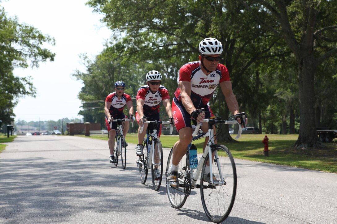 Marines with the Wounded Warrior Battalion – East and Brian Renier, cycling project manager, ride around Marine Corps Base Camp Lejeune during one of their cycling sessions. Cycling is currently being used as a form of rehabilitation with the Warrior Athlete Rehabilitation program with the battalion.  It is designed to help with the recovery process and overcome the Marines’ injuries while getting back into physical shape and building their morale.  Aside from increasing muscle strength, endurance and balance, it also manages weight, improves memory and help controls behavior.