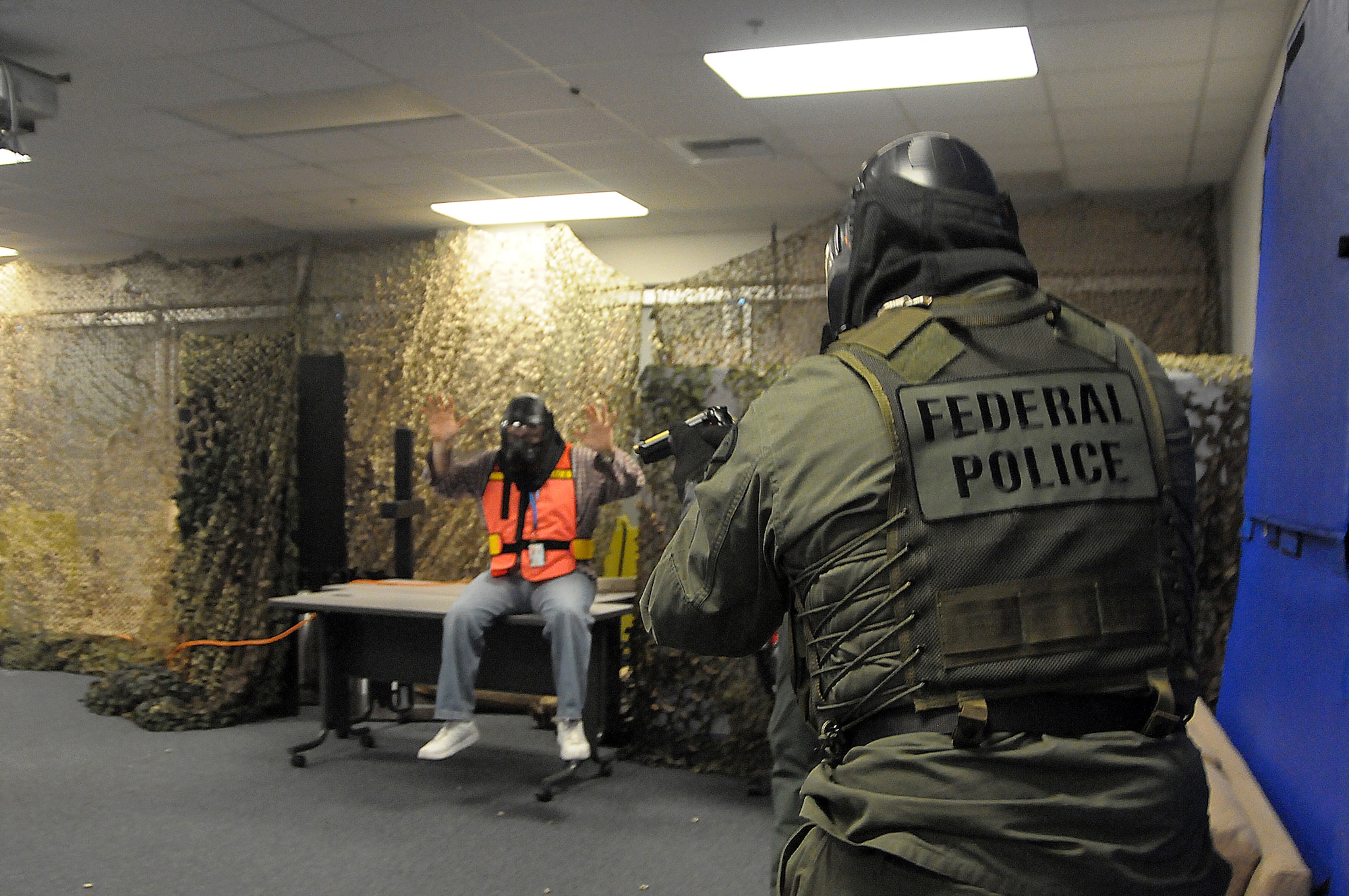 A perpetrator is captured during the Blue Falcon Exercise, July 13. El Segundo Police and Fire Departments played in the exercise, which tested Los Angeles Air Force Base personnel’s ability to respond to a variety of scenarios. (Photo by Joe Juarez)