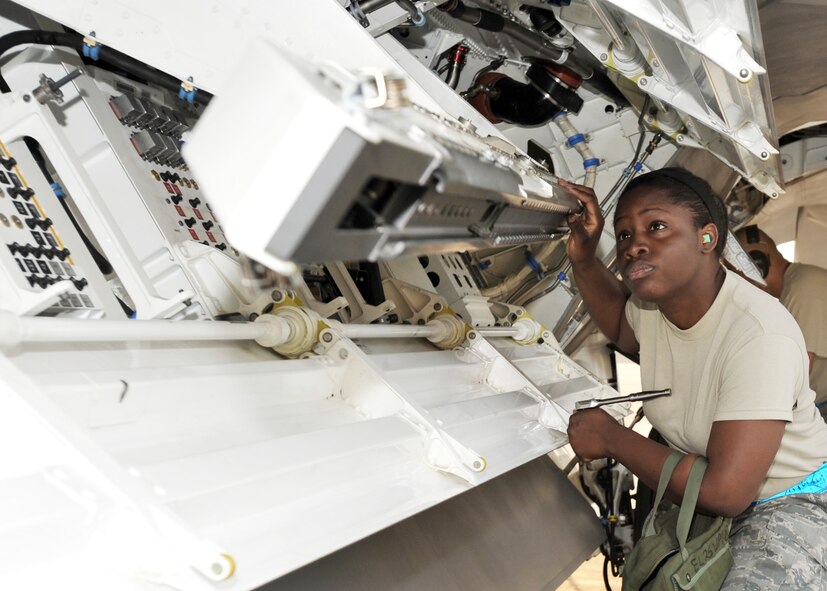 Airman 1st Class Thomasina Smalls inspects the missile bay of an F-22 Raptor during a load crew competition July 10 at Elmendorf Air Force Base, Alaska. She is assigned to the 3rd Aircraft Maintenance Squadron.  (U.S. Air Force photo/Senior Airman Laura Turner)