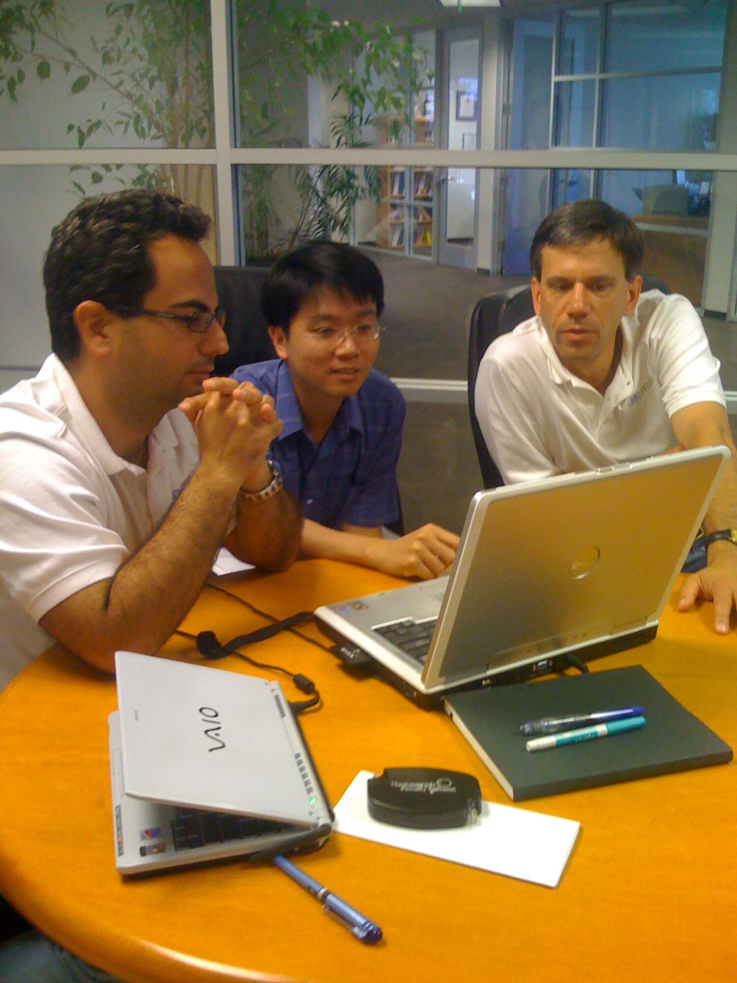 Basic research funding from the Air Force Office of Scientific Research (AFOSR) has led to the development of software for aligning maps with satellite imagery called MapStrata. Pictured above, Cyrus Shahabi (left), Jason Chen (center), and Craig Knoblock (right) from Geosemble Technologies review the latest version. (Image courtesy of Dr. Craig Knoblock, University of Southern California, Information Sciences Institute)