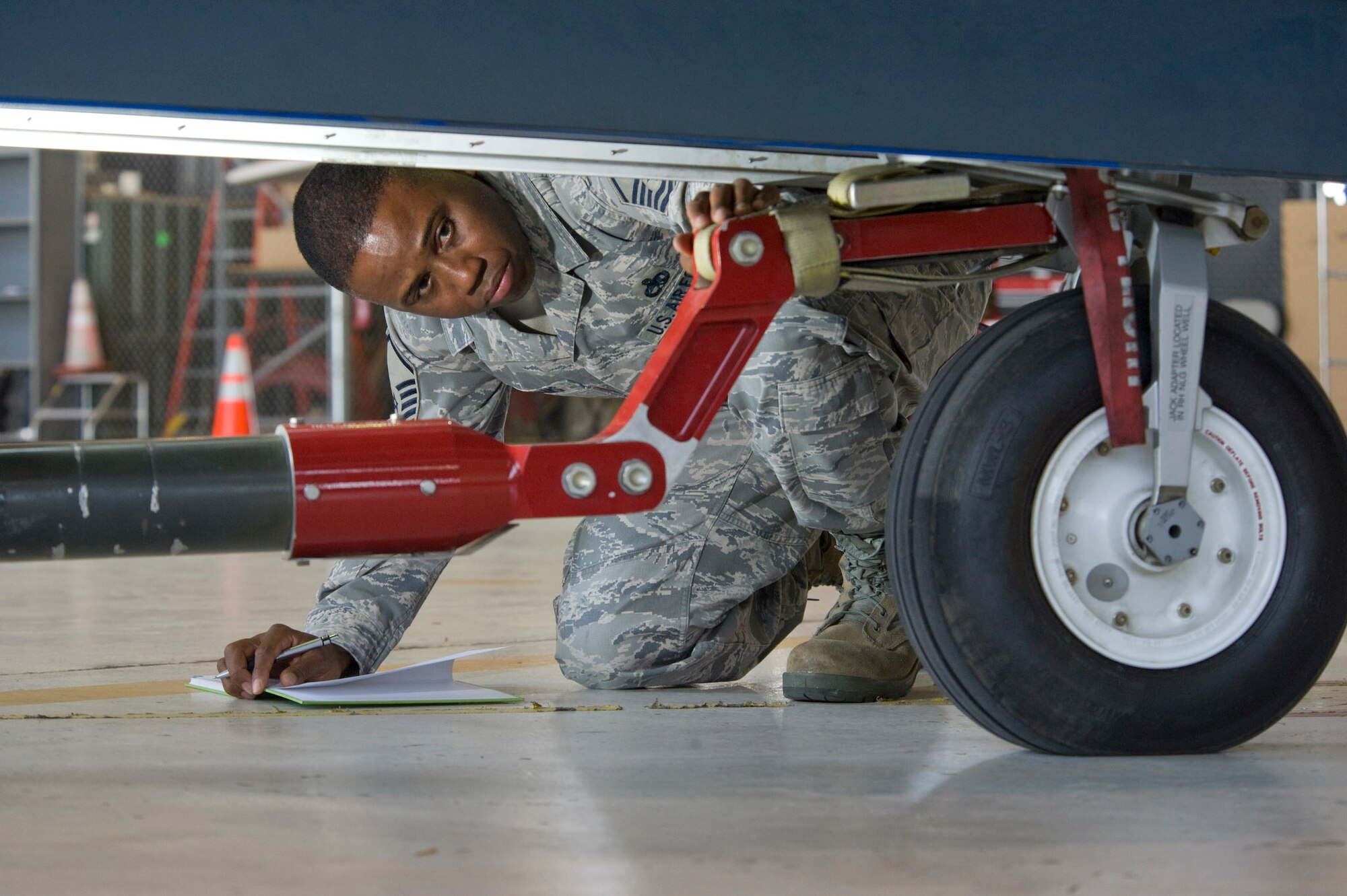 Master Sgt. Gregory Williams inspects a strap added to a tow bar based on a safety recommendation. Sergeant Williams is the Global Hawk suitability manager with the Air Force Operational Test Evaluation Center at Edwards Air Force Base, Calif. (U.S. Air Force photo/Master Sgt Jack Braden)