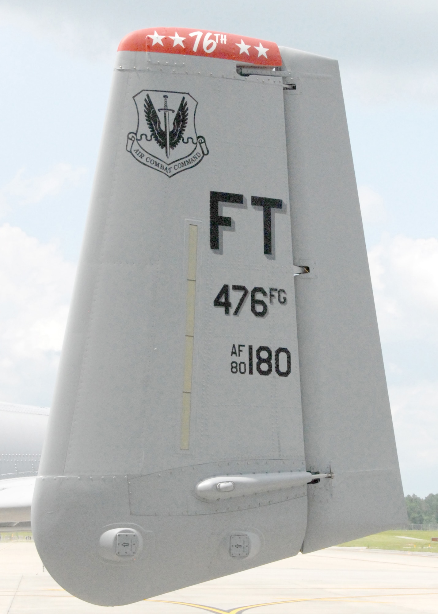 The tail of A-10C, number 180, at Moody Air Force Base, Ga.  The 23rd Wing at Moody painted two aircraft in the colors of the Air Force Reserve's 76th Fighter Squadron to pay homage to the 476th Fighter Group's activation July 11, 2009.  The 76th is part of the 476th Fighter Group, the Air Force's first A-10 associate unit, which is paired with the active duty's 23rd Wing.  (U.S. Air Force photo/Master Sgt. Bill Huntington)