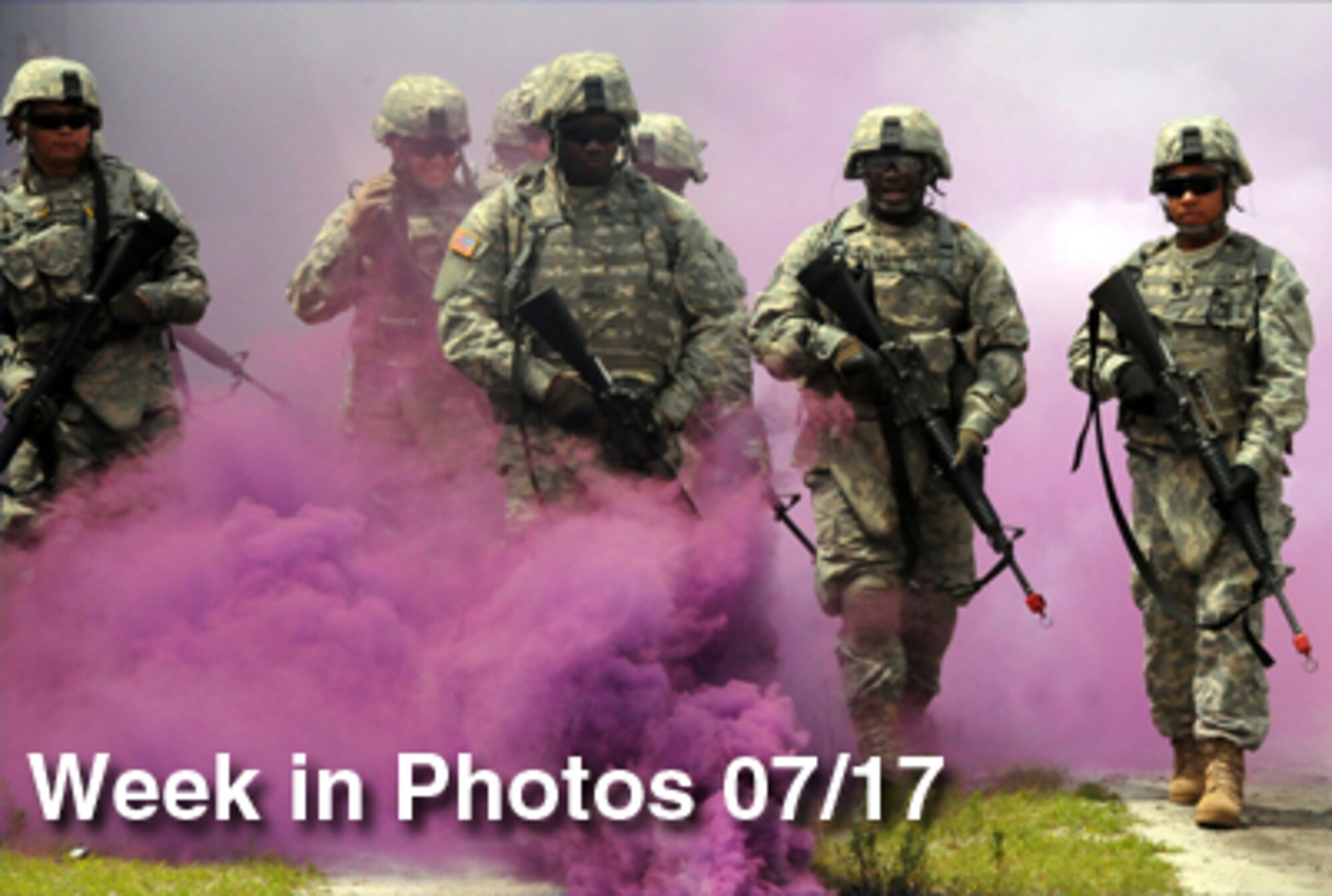 Airmen and Sailors undergoing individual augmentee training walk through a cloud of smoke during an exercise on the training range at Fort Dix, N.J. The servicemembers are undergoing training before deploying to support operations Enduring Freedom and Iraqi Freedom. (U.S. Navy photo/Petty Officer Lenny M. Francioni)