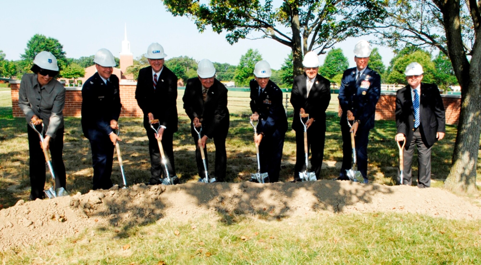 Maj. Gen. Ralph Jodice, AFDW commander, Air Force District of Washington commander and distinguished guests break ground for the National Capital Regional Relocation Administrative Facility groundbreaking ceremony at Andrews AFB. Pictured: from left to right are Ms. CarolAnn Beda, Air Force Center Engineering and Environment; Col Brian Bellacicco, director AFDW A4/7; Mr. John Manning, President and COO, CDM Corp; Mr. William Davidson, Administrative Assistant, SECAF; General Jodice; Mr. Robert Corsi, Dep. Administrative Assistant, SECAF; Col. Steven Shepro, 316th Wing commander and Mr. Dennis Firman, director of AFCEE. (U.S. Air Force photo by A1C Melissa Rodrigues)  