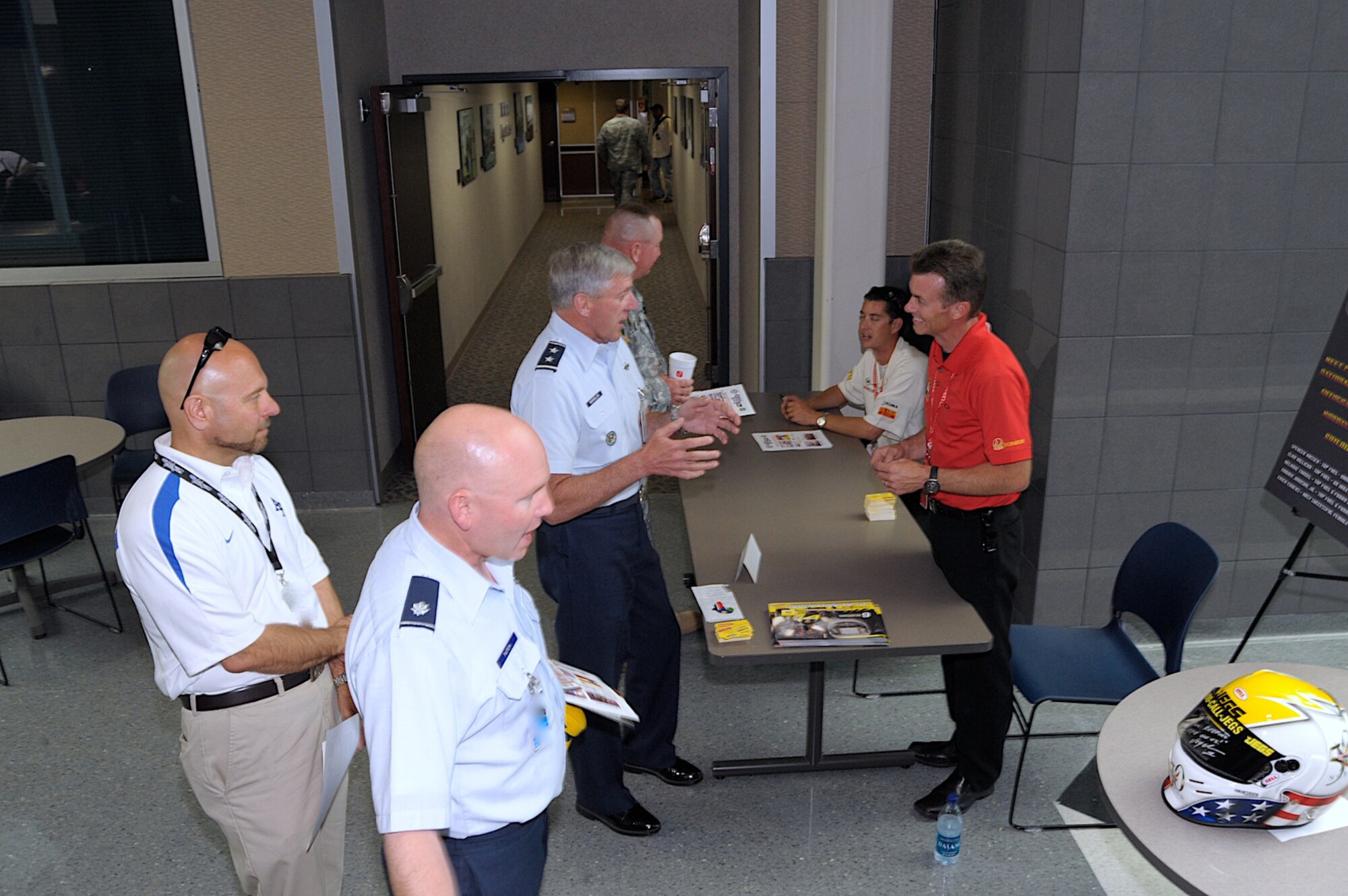 Maj. Gen. John Bordelon, NORAD-USNORTHCOM chief of staff, talks with Top Fuel driver Clay Millican July 13 at Building 2. Spencer Massey, another Top Fuel driver, is seated in the background. (Photo courtesy NORAD-USNORTHCOM)