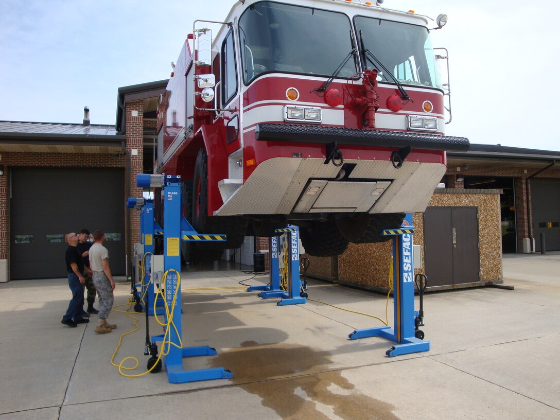 The Langley Fire Department received six lifts recently to assist with repairs to the P-23 crash truck. The new lifts will save approximately $5,000 per maintenance job. (U.S. Air Force photo/James Wise)