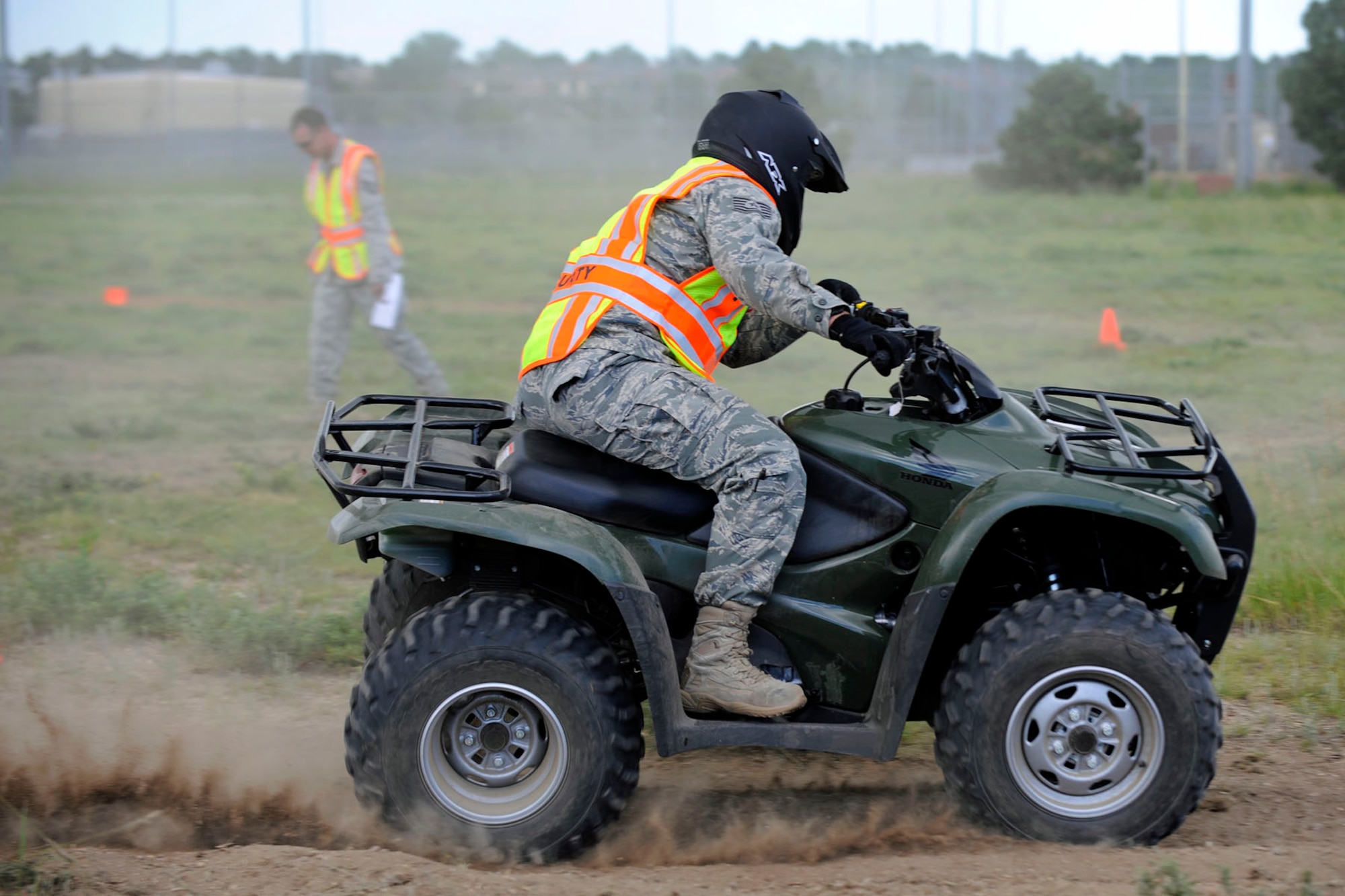 PETERSON AIR FORCE BASE, Colo. -- A 721st Security Forces Airman raises a little dust during the all-terrain vehicle training at Peterson June 6. According to Tech. Sgt. Sean Gallagher, 721st SFS unit deployment monitor, the training is designed to enhance Cheyenne Mountain security force response capabilities and broaden the skills of deploying security forces Airmen. (Air Force photo by Craig Denton)