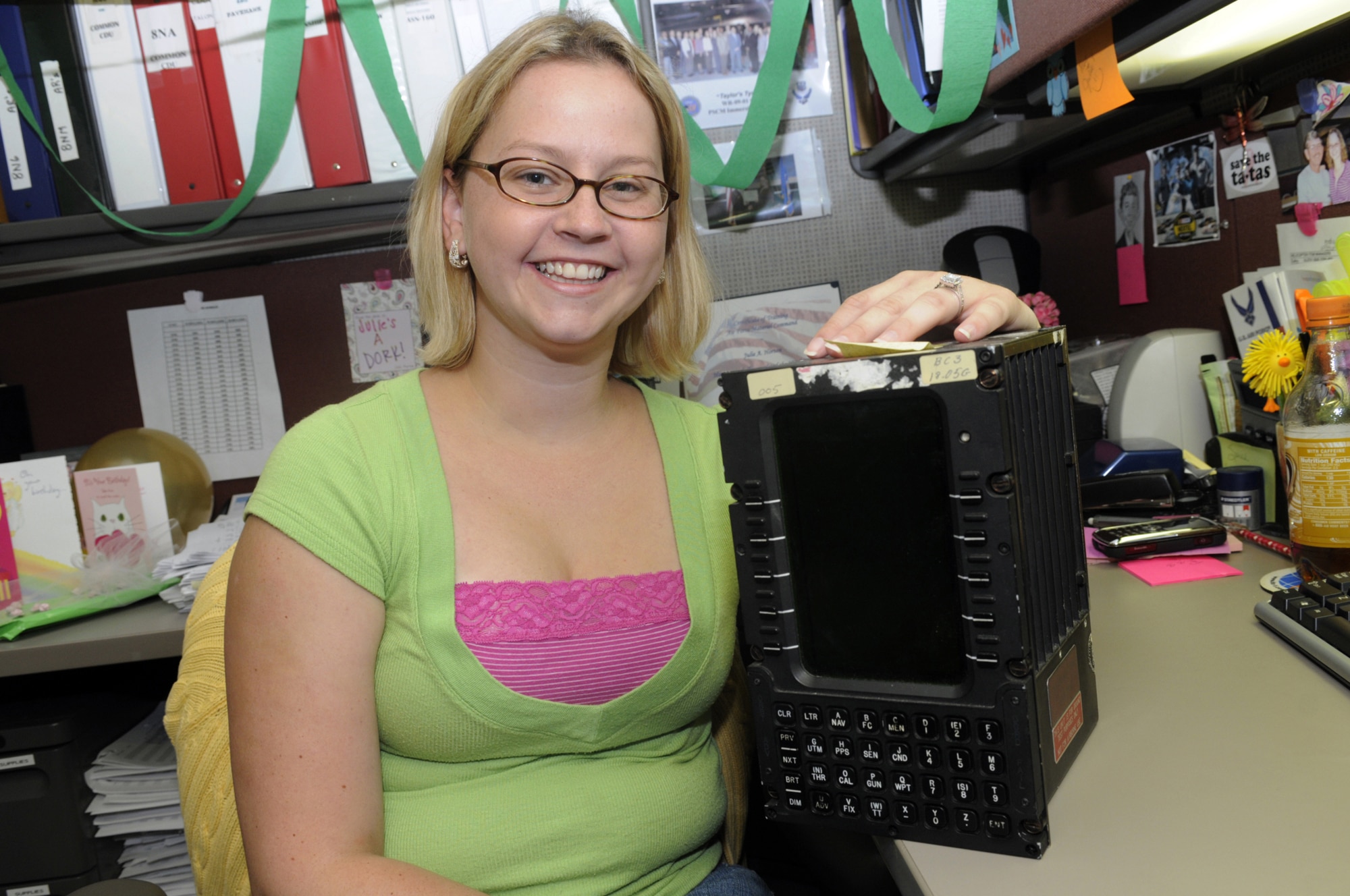 Julie Horton is shown with a control indicator used on multiple SOF aircraft. She is an item manager in the 411th Supply Chain Management Squadron. U. S. Air Force photo by Sue Sapp