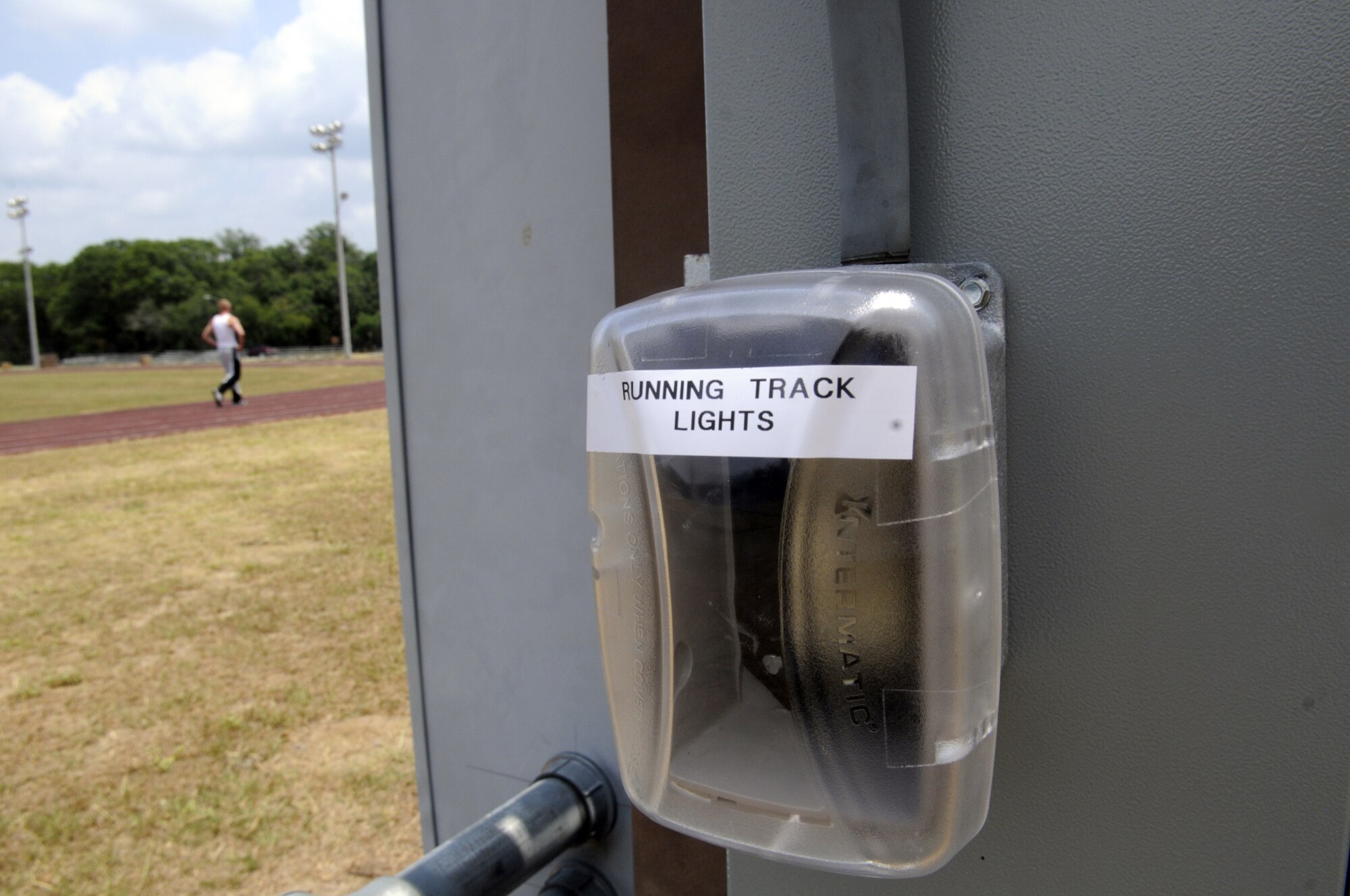 The Fitness and Sports Center teamed with the 78th Civil Engineer Squadron to install an on/off timer on the Fitness Center’s track lights. U. S. Air Force photo by Sue Sapp  