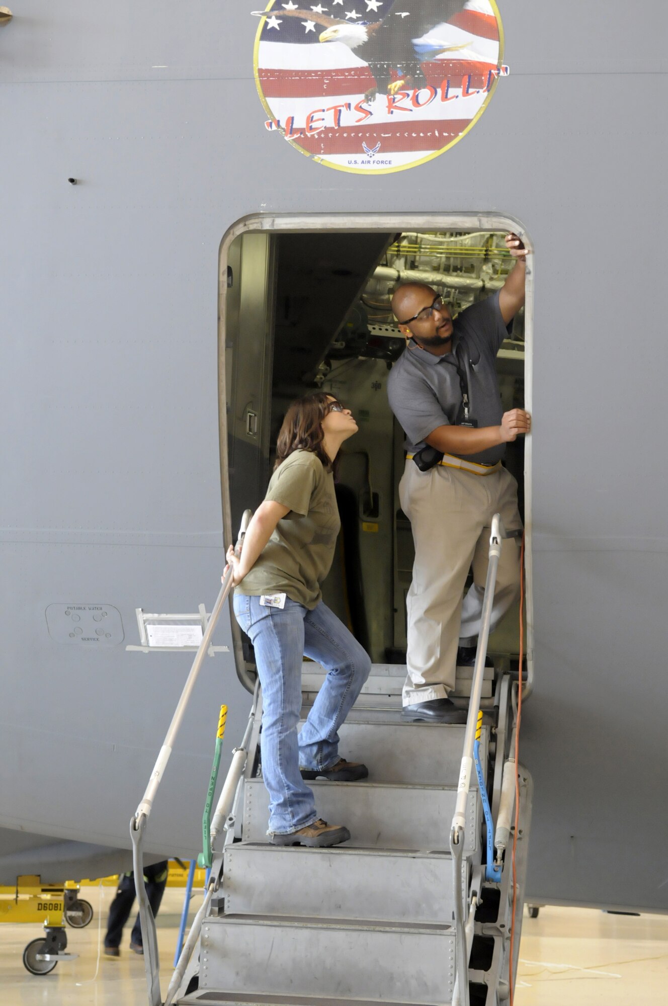 Jeffrey Williams, C-17 Aircraft overhaul supervisor, shows, Cathy Kurtz, Houston County High School senior,how an inspection is done on a C-17 door seal. U. S. Air Force photo by Sue Sapp