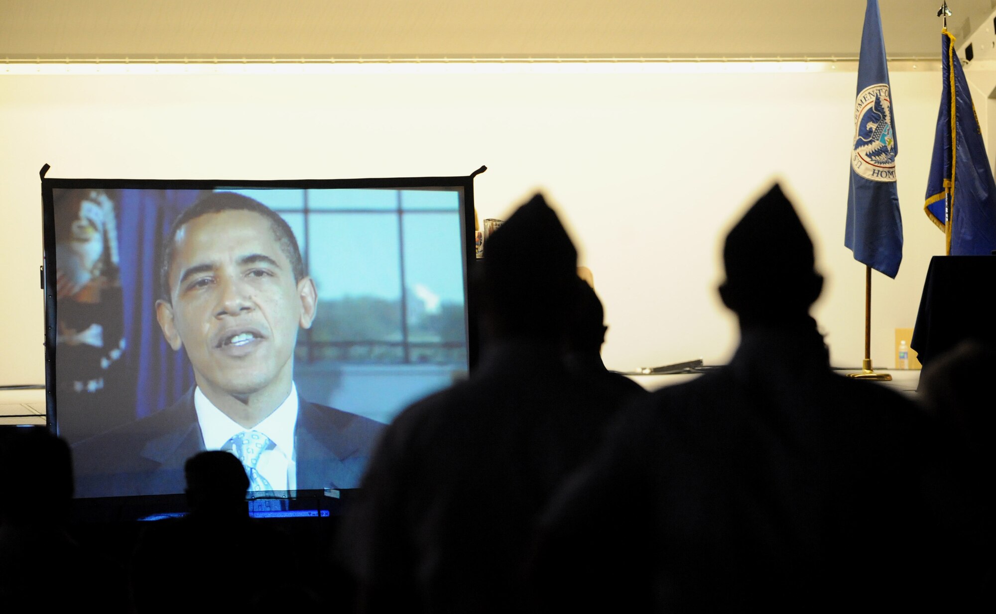 A videotaped message from President Barack Obama is played honoring the role and commitment of the newly sworn in service members during the naturalization ceremony at Freedom Fest 4th of July celebration, Nellis Air Force Base, Nev.

(U.S. Air Force photo/ Master Sgt. Kevin J. Gruenwald) released


 
(U.S. Air Force photo/ Master Sgt. Kevin J. Gruenwald) released




















  












 











































  












 

























