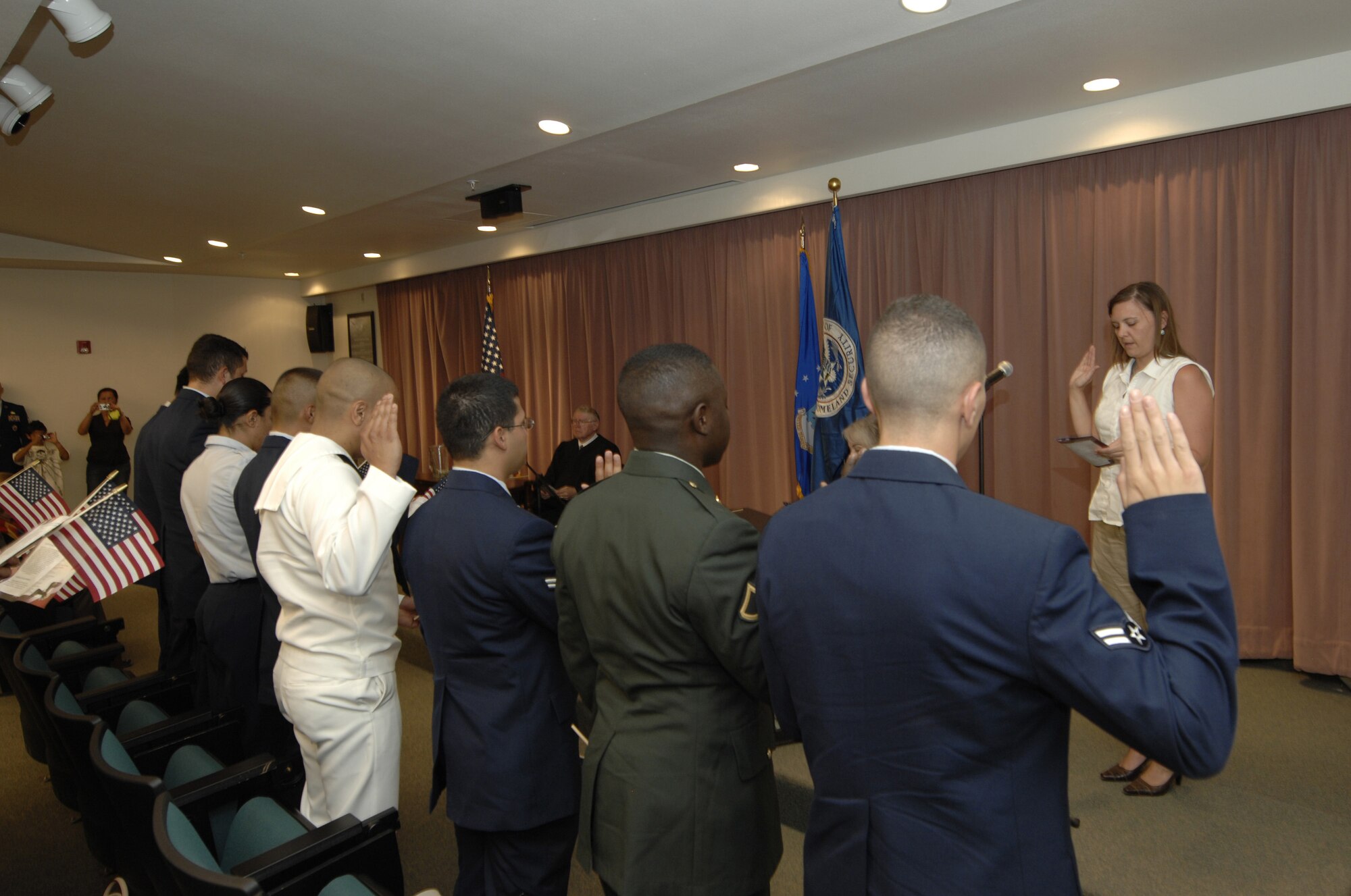 Eleven service members are sworn in by Melissa Jamie, Deputy Clerk of the Court during a Naturalization Ceremony at Nellis Air Force Base, Nev. on July 4th during the Freedom Fest celebration. The applicants included members of the U.S. Air Force, Army, Navy Reserve, and Coast Guard. Members hailed from Armenia, Cameroon, Colombia, Mexico, Philippines, and South Korea. One candidate, Airman 1st Class Sun Woong Whang was sworn in along with his mother and brother.
(U.S. Air Force photo/ Master Sgt. Kevin J. Gruenwald) released

090704-F-6911G-008.jpg






















  












 











































  












 

























