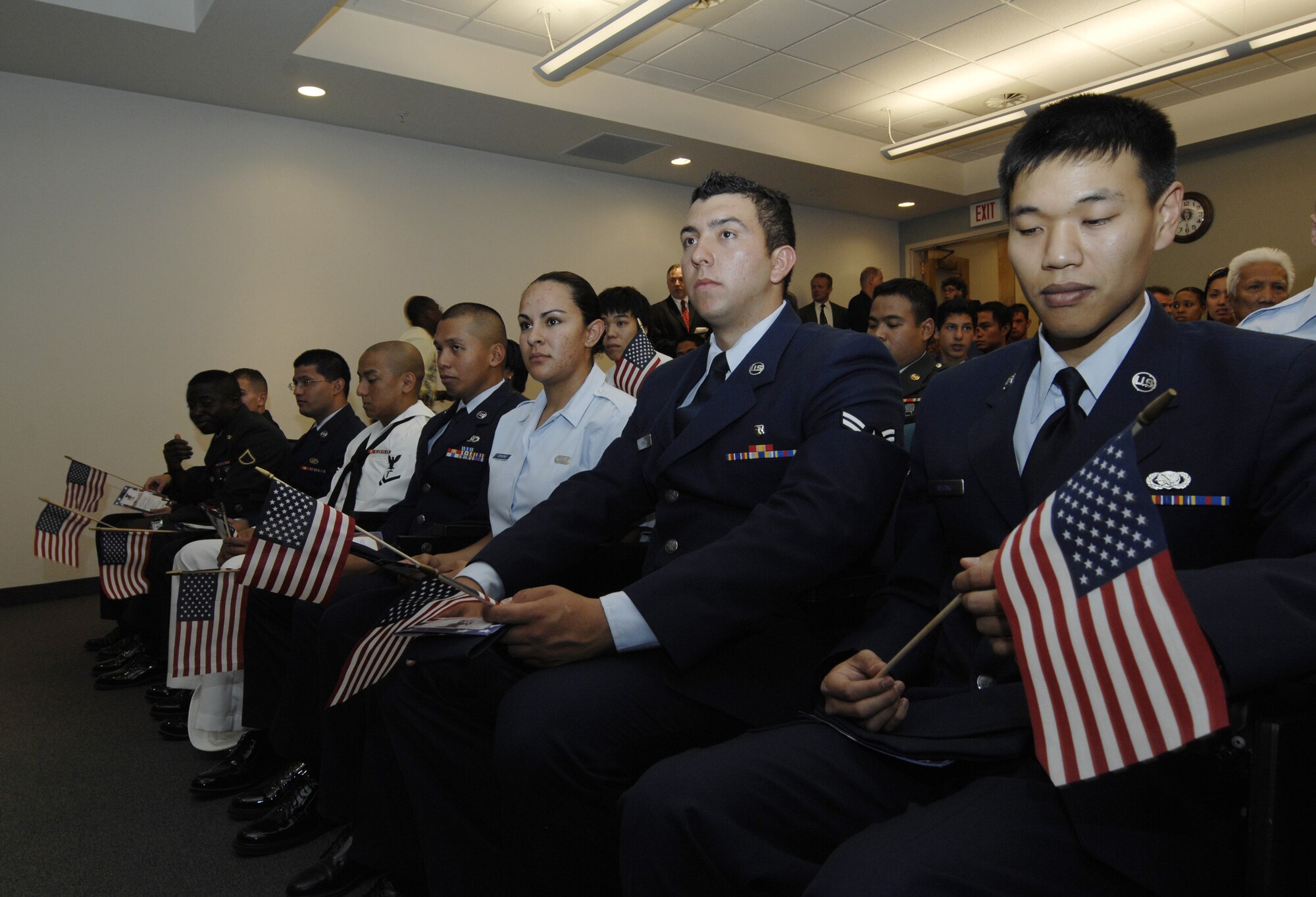 Eleven service members wait in anticipation to be sworn in during a Naturalization Ceremony at Nellis Air Force Base, Nev. on July 4th during the Freedom Fest celebration. The applicants included members of the U.S. Air Force, Army, Navy Reserve, and Coast Guard. Members hailed from Armenia, Cameroon, Colombia, Mexico, Philippines, and South Korea. One candidate, Airman First Class Sun Woong Whang was sworn in along with his mother and brother.

(U.S. Air Force photo/ Master Sgt. Kevin J. Gruenwald) released























  












 











































  












 

























