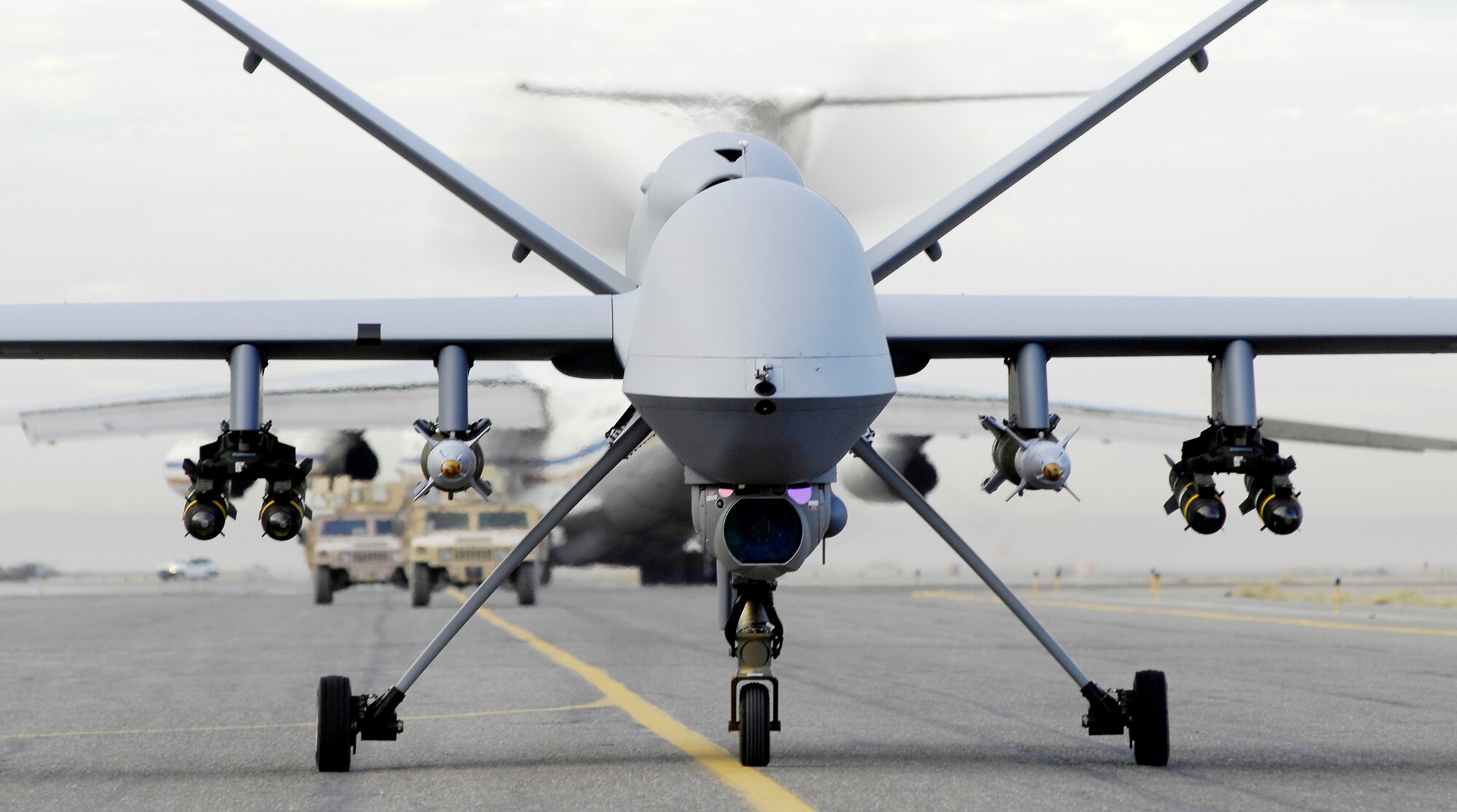 An armed MQ-9 Reaper unmanned aerial vehicle taxis down a runway in Afghanistan. During operations July 15, a Reaper released several guided bomb unit-12's on possible improvised explosive devices located in a roadway near Qalat. (U.S. Air Force photo/Staff Sgt. Brian Ferguson)

